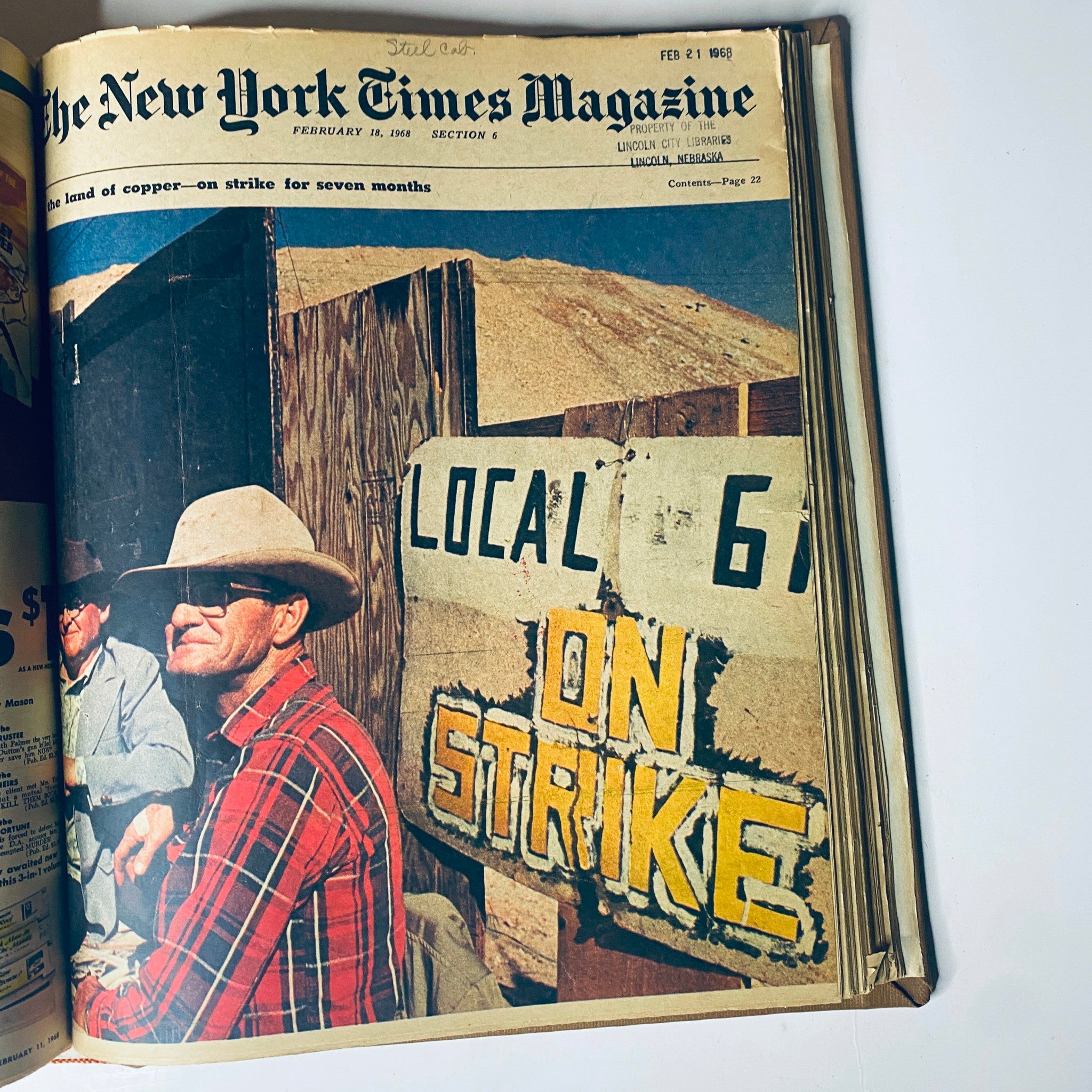 Cover of The New York Times Magazine February 18, 1968, depicting two men seated near a striking sign, symbolizing labor disputes and workers' rights in the copper mining industry.