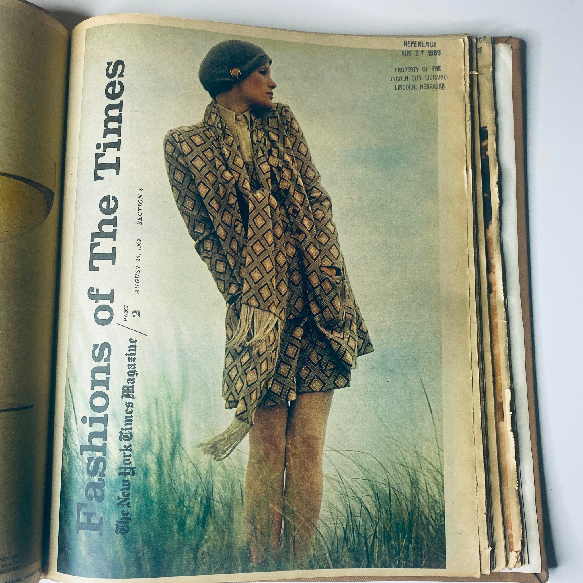 Fashion spread from The New York Times Library Edition Bound Magazine July-August 1969, featuring a model in a patterned outfit against a natural backdrop.