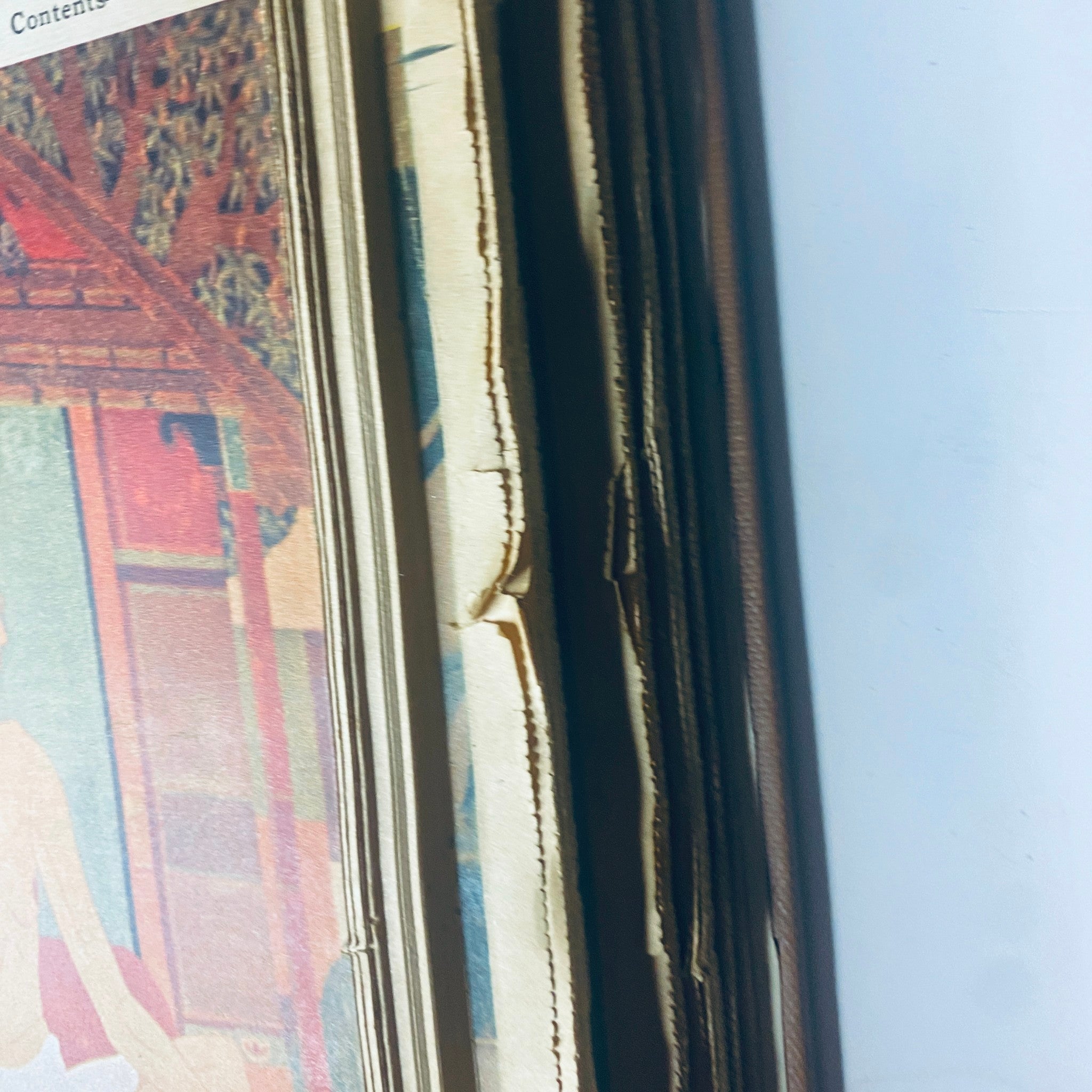 Close-up of the spine and edge of the May-June 1969 volume of The New York Times Bound Magazine, showcasing the delicate binding and vintage pages.