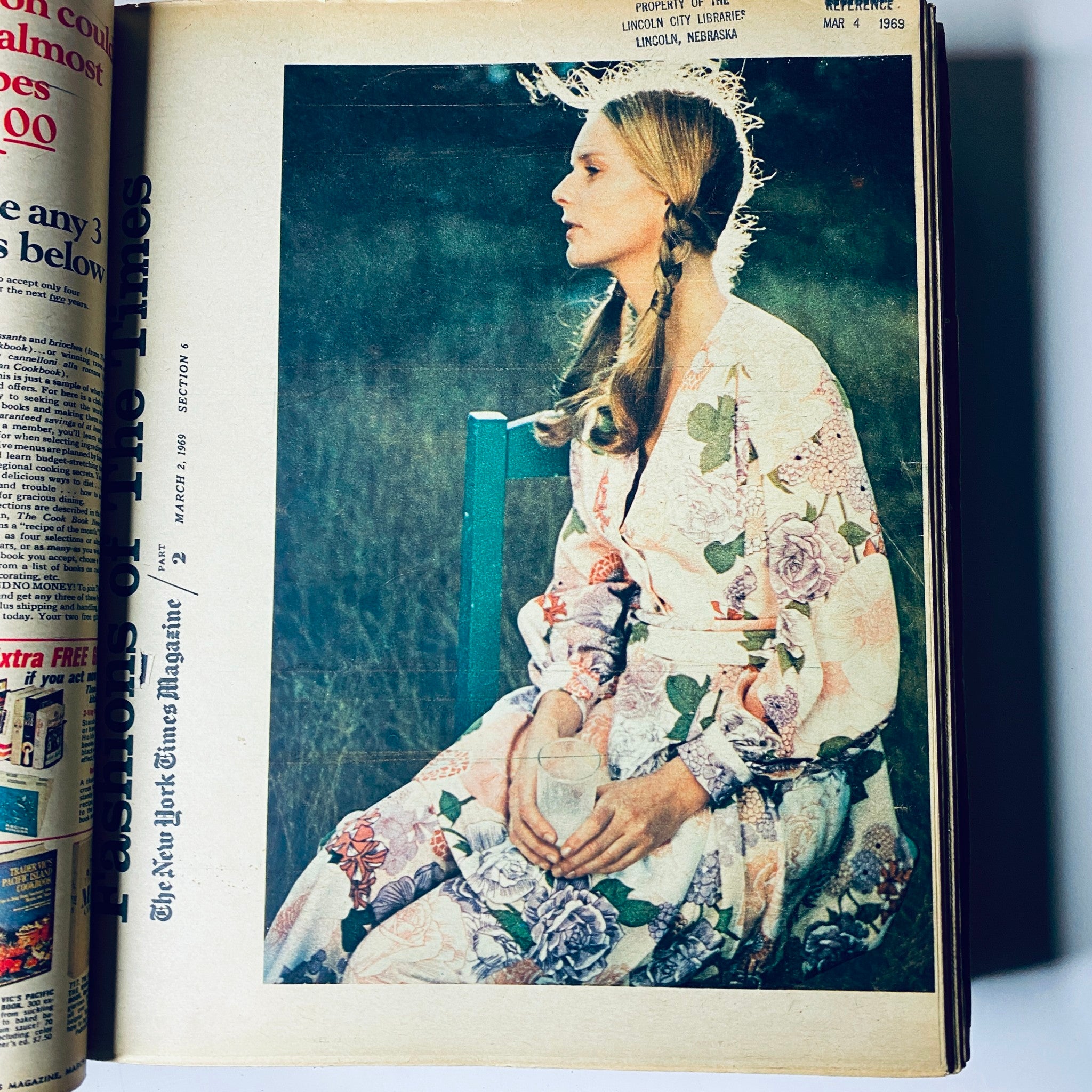 Cover of The New York Times Bound Magazine 1969 March - April featuring a woman in floral attire holding a glass, highlighting fashion photography from the period.