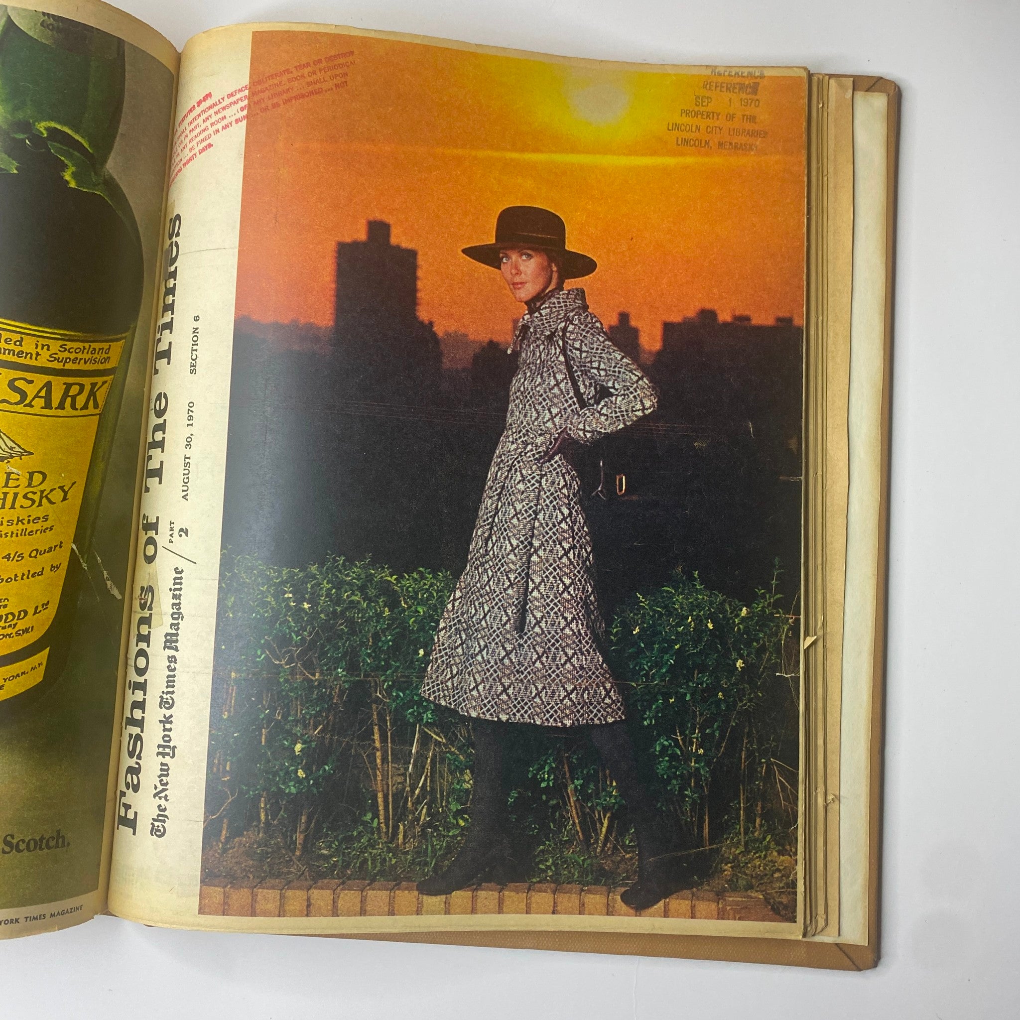 The New York Times Library Bound Magazine July-August 1970 showcasing a fashion photo of a model in a stylish coat during sunset.