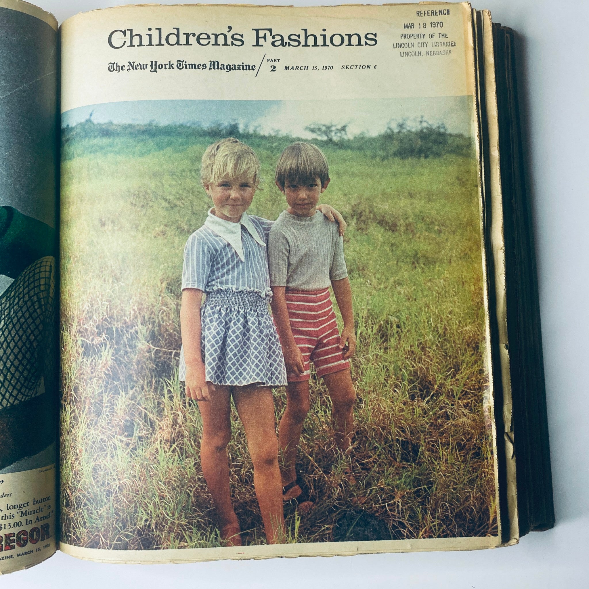 Children's fashion feature in 'The New York Times Magazine March 15, 1970,' showing two children in short outfits standing in a grassy field, Part 2.