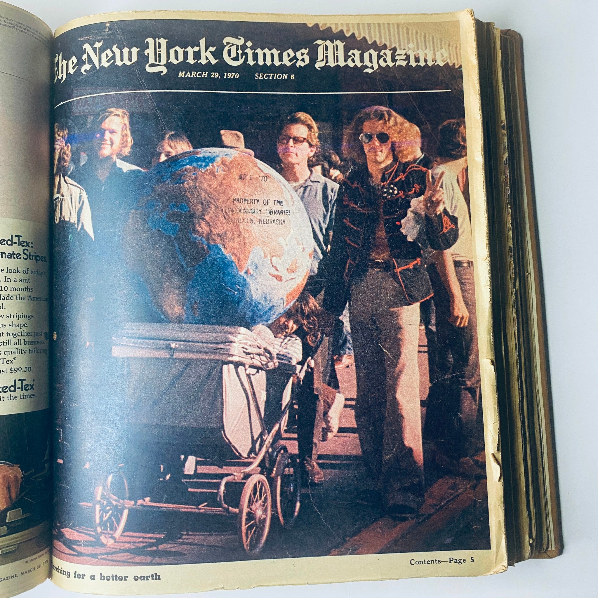 The New York Times Magazine, March 29, 1970, depicting a group of people at an environmental event, emphasizing the message of Earth preservation.