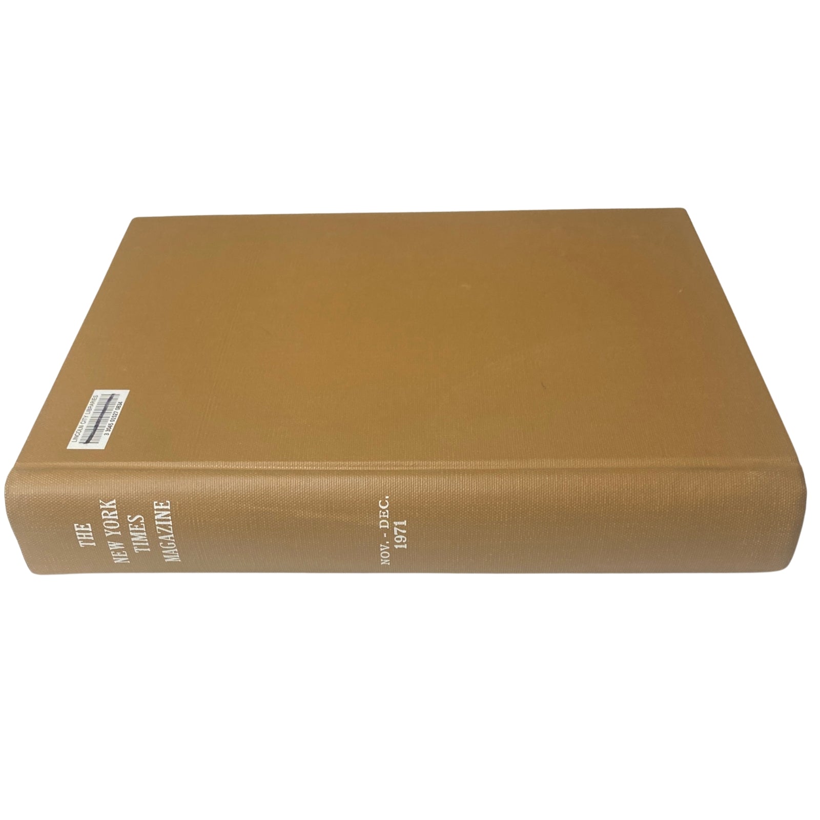 Side view of the New York Times Bound Magazine, 1971 November - December, displaying the title on the spine and a library sticker