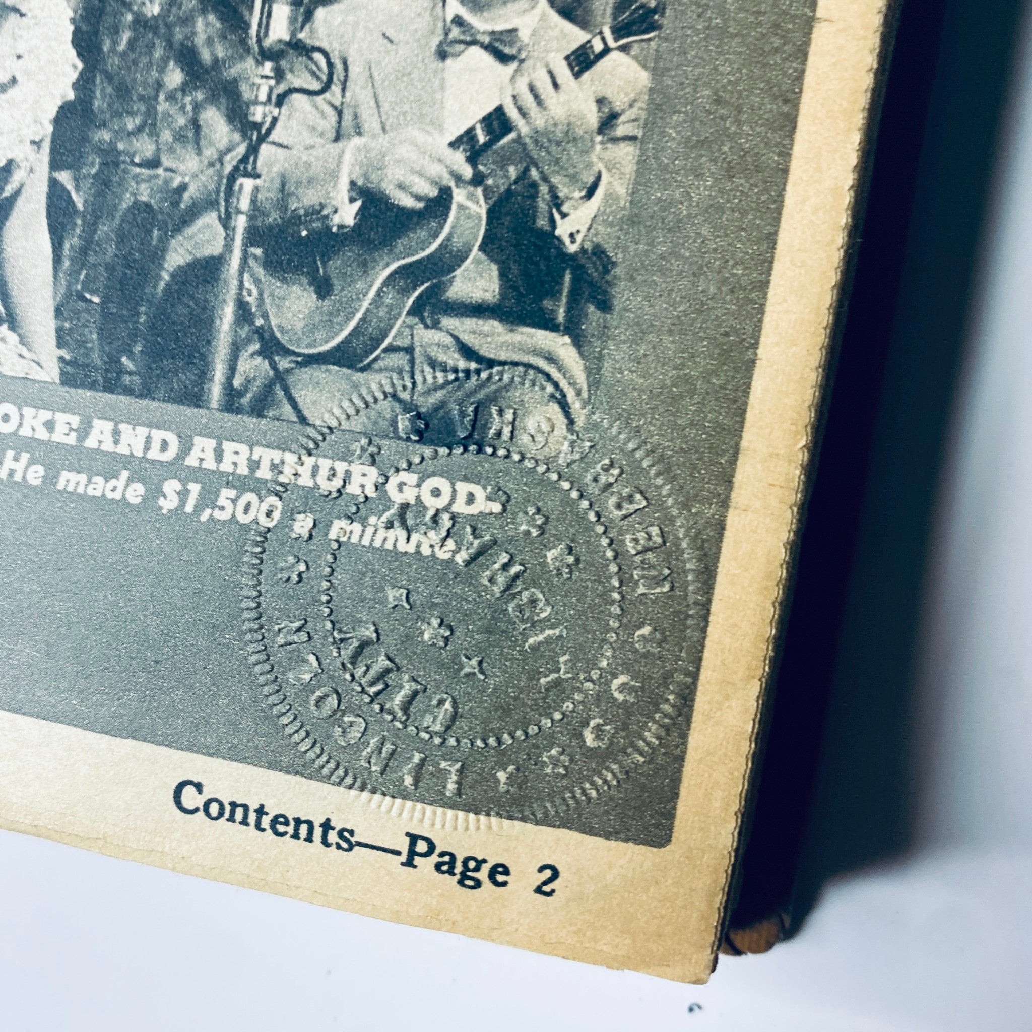 Page showing contents of The New York Times Library Edition Bound Magazine July - August 1971, featuring a vintage illustration and a library stamp from Lincoln City Library.