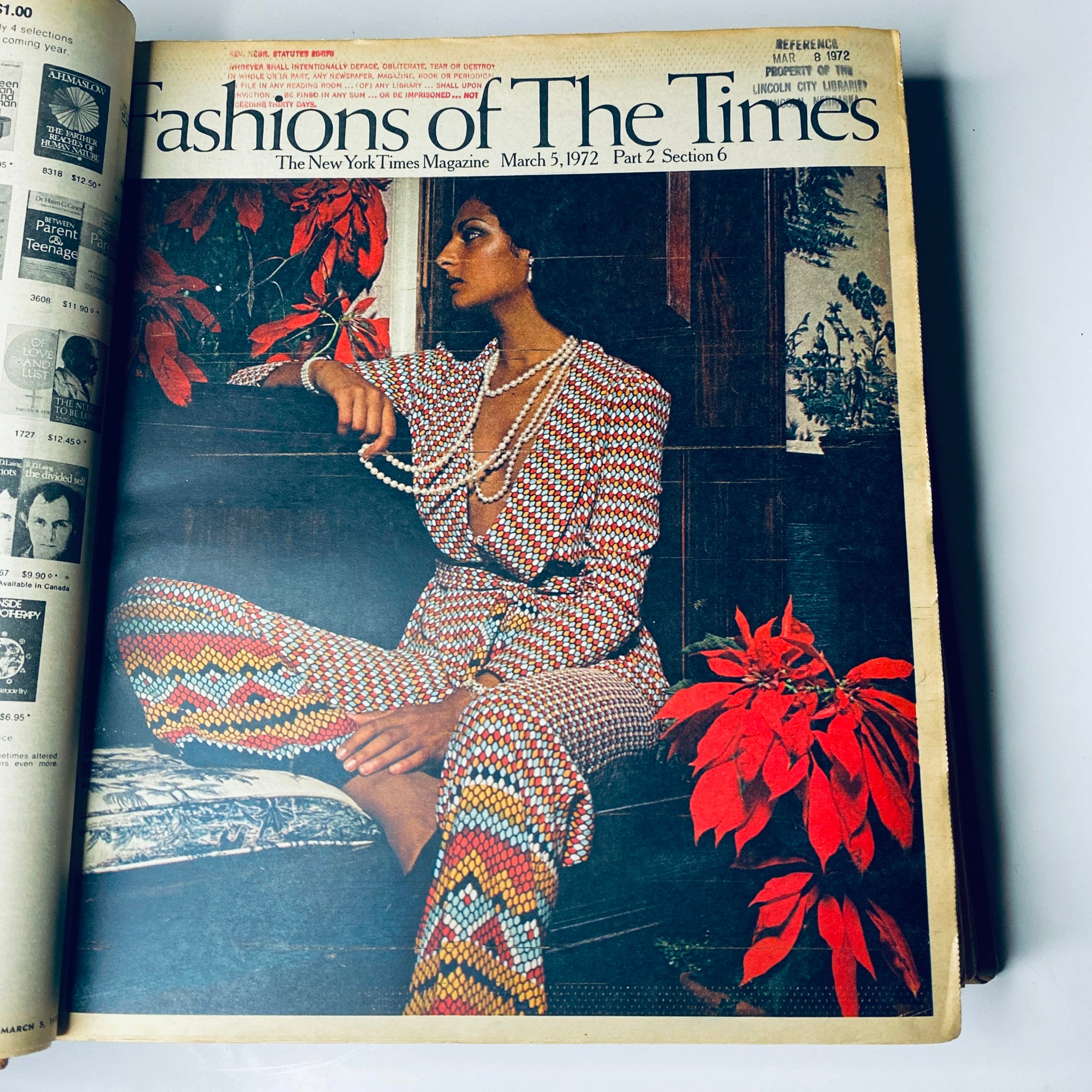 The New York Times Magazine March 5, 1972 edition showcasing the 'Fashions of The Times' with a model wearing a colorful patterned outfit and pearls set against a background of vibrant red leaves.