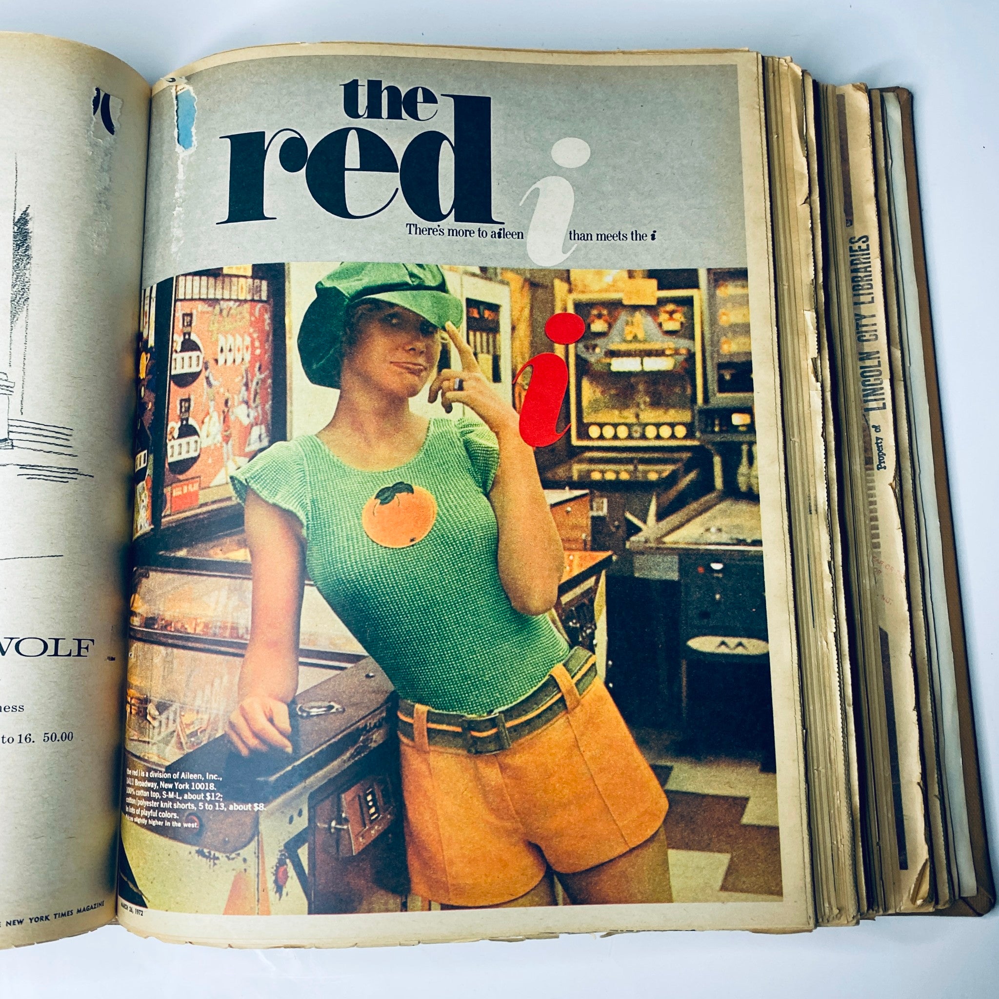 The New York Times Magazine featuring the 'Red i' from March 19, 1972, displaying a young woman wearing a playful outfit with an orange graphic in a colorful arcade setting.