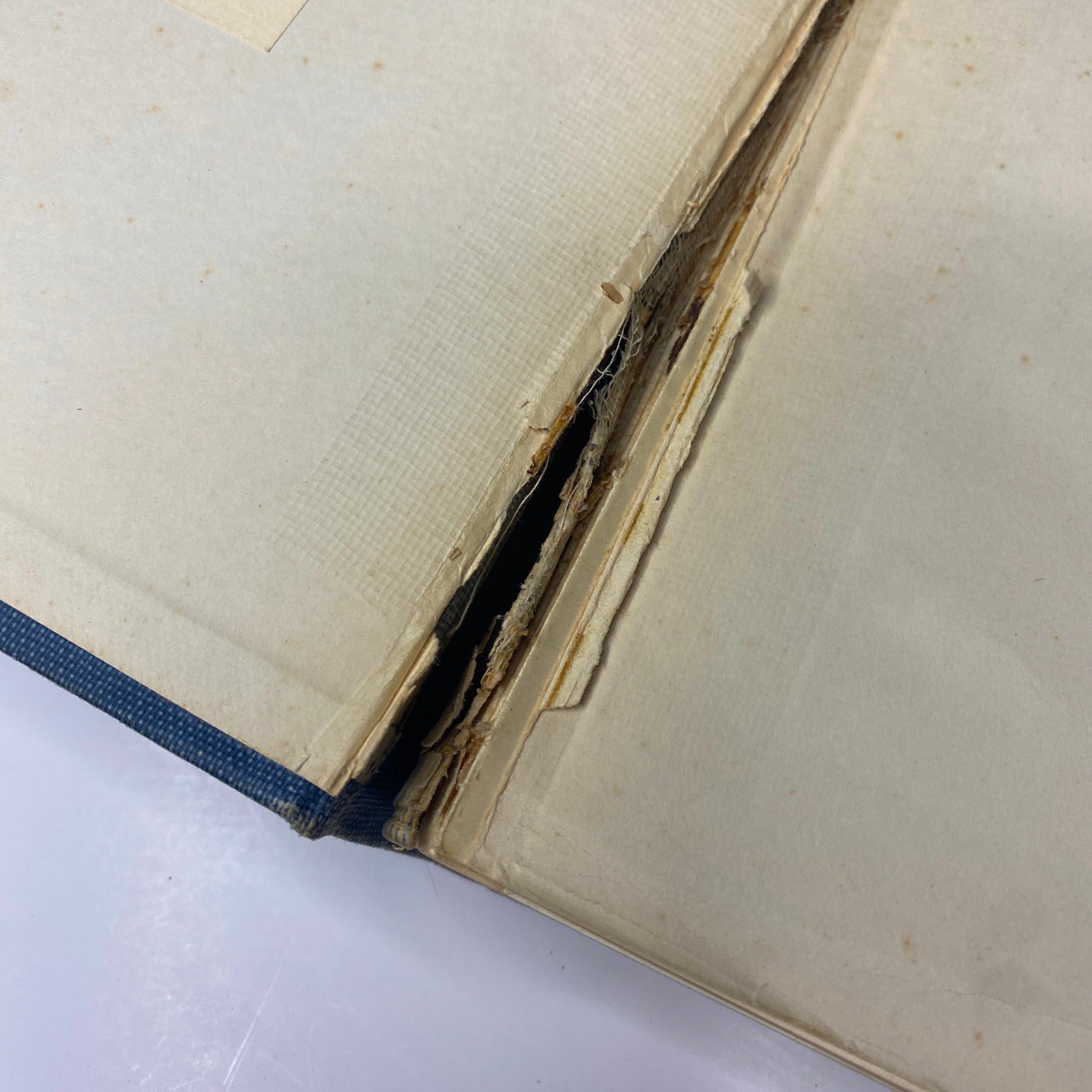 Inside view of the Time Magazine Bound Weekly 1924 July - December, showcasing a damaged page with tears and yellowing edges.