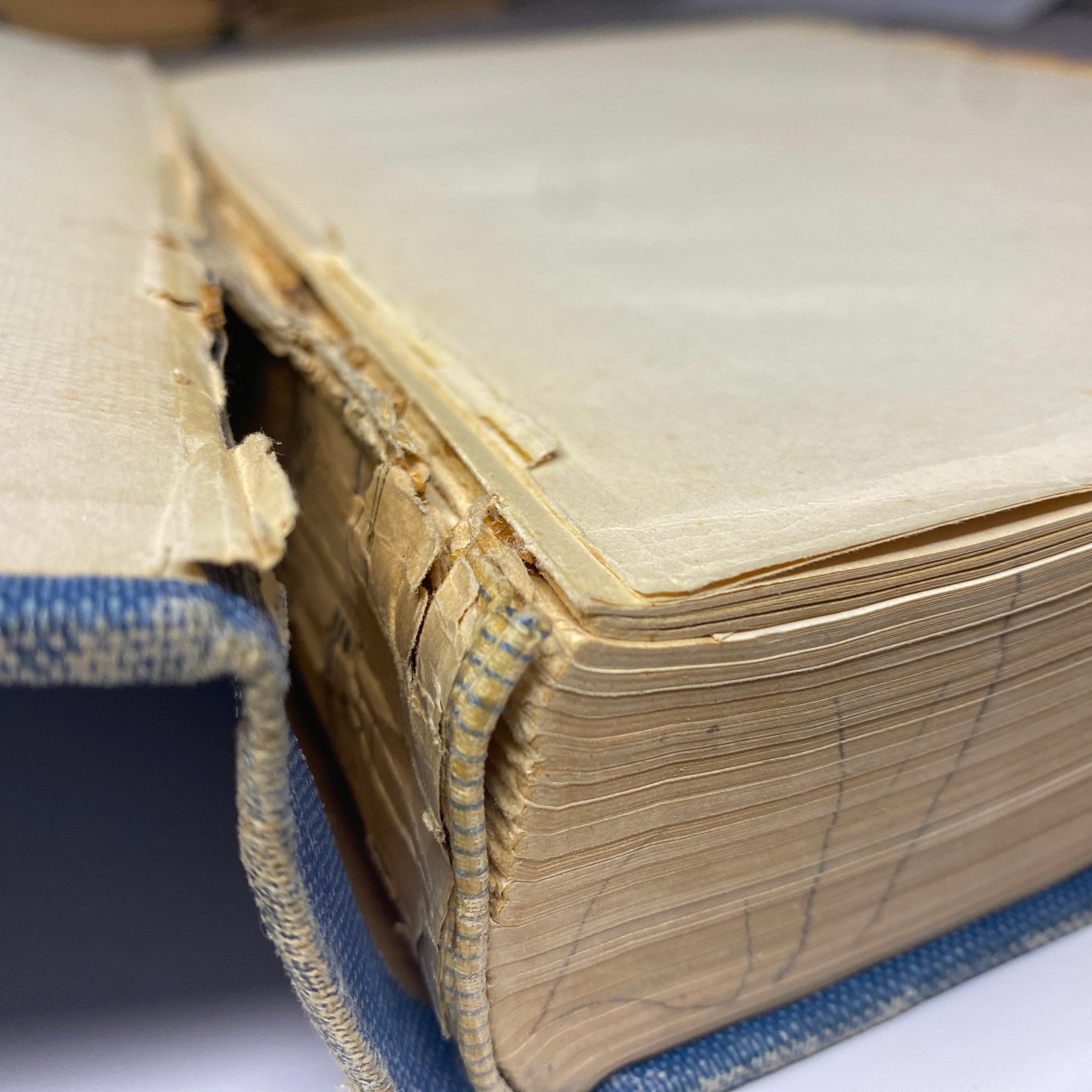 Detailed view of the binding of the Time Magazine Bound Weekly 1924 July - December, illustrating the detachment and creased pages.