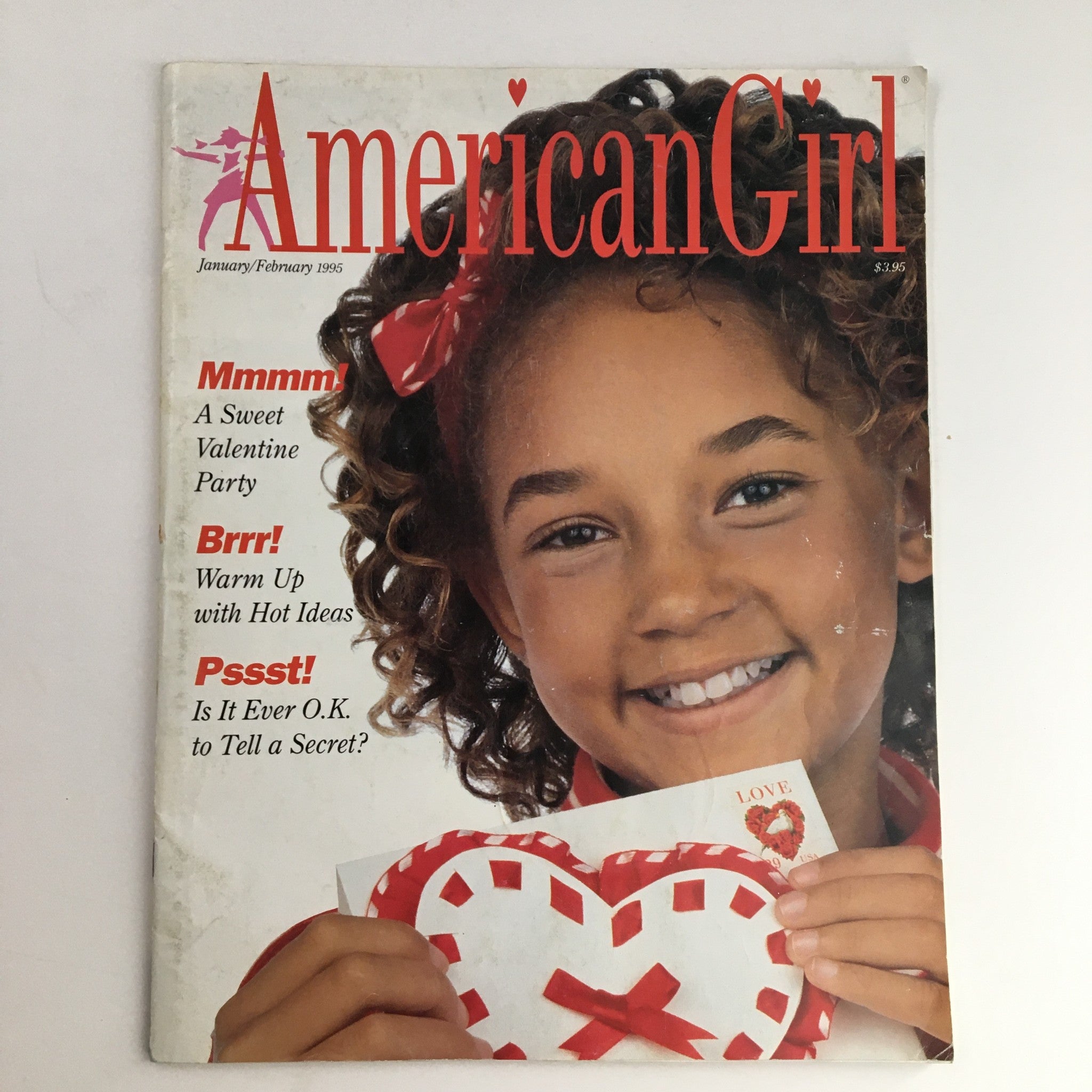 Cover of American Girl Magazine January 1995 titled 'A Sweet Valentine Party', featuring a young girl smiling while holding a heart-shaped card, resonating with themes of childhood joy and Valentine celebrations.
