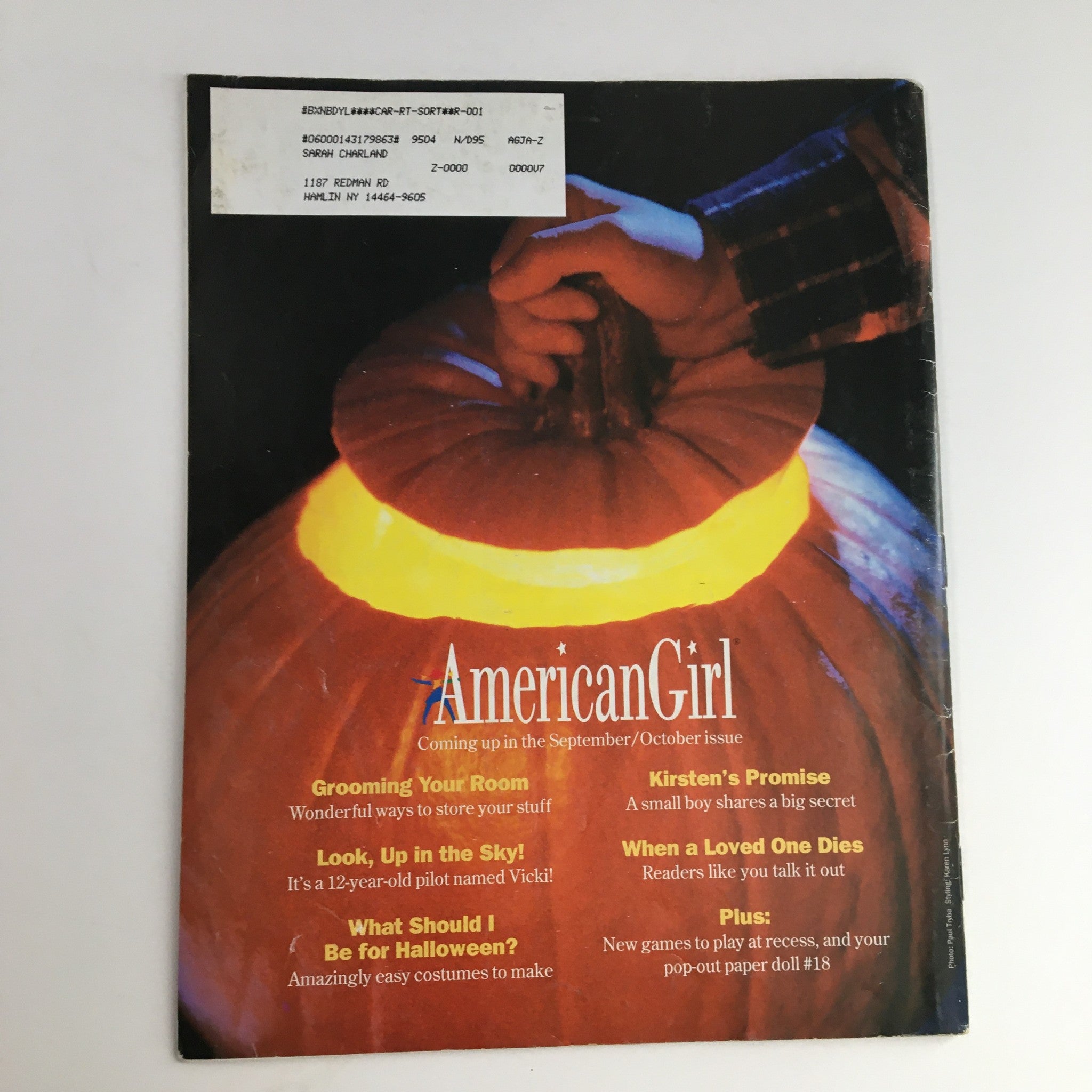 Back cover of American Girl Magazine July 1995 featuring a glowing pumpkin, with upcoming articles like 'Grooming Your Room' and 'What Should I Be for Halloween?'.