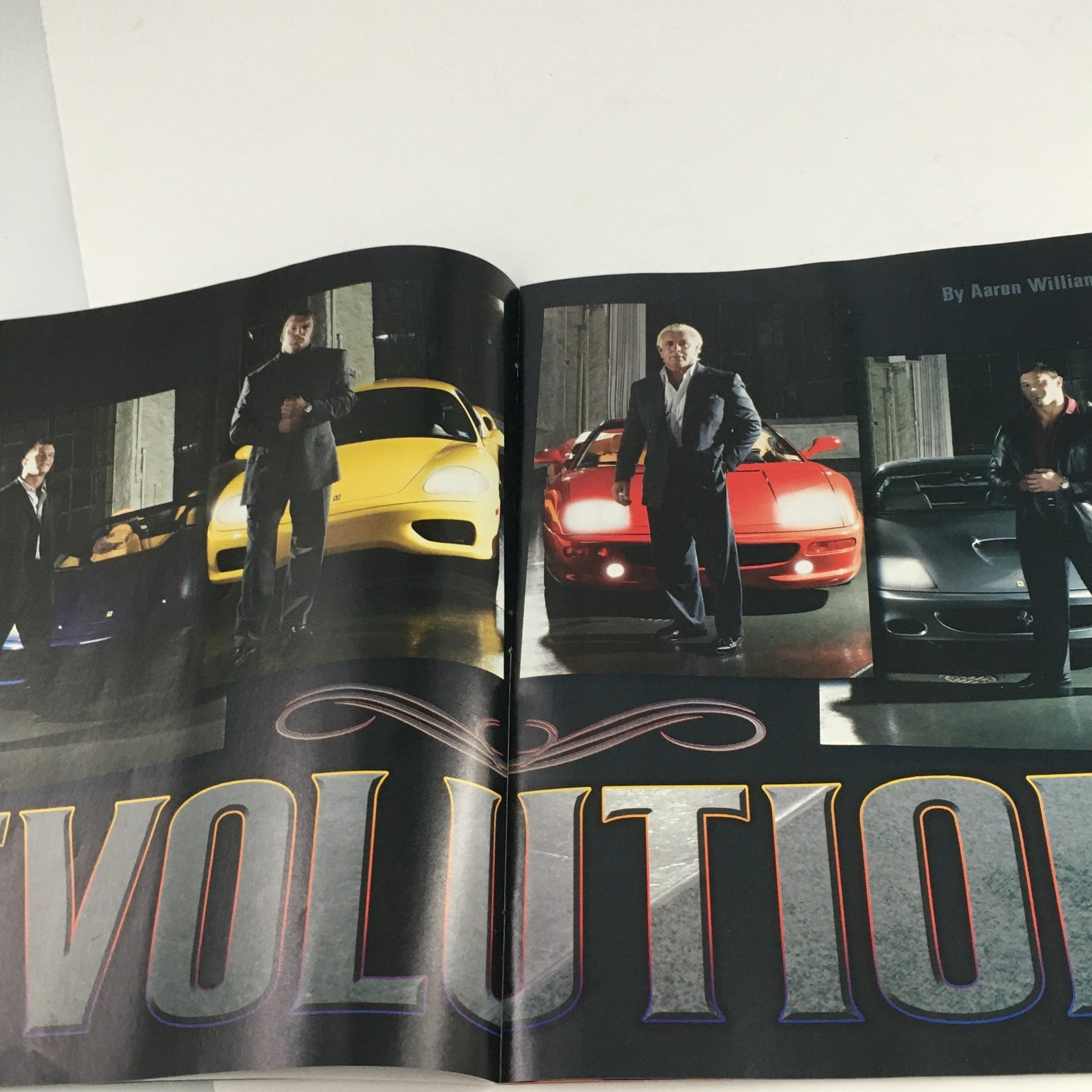 WWE Raw Magazine January 2004 showcasing iconic wrestling personalities in a spread titled 'Evolution', featuring multiple wrestlers with luxury cars.