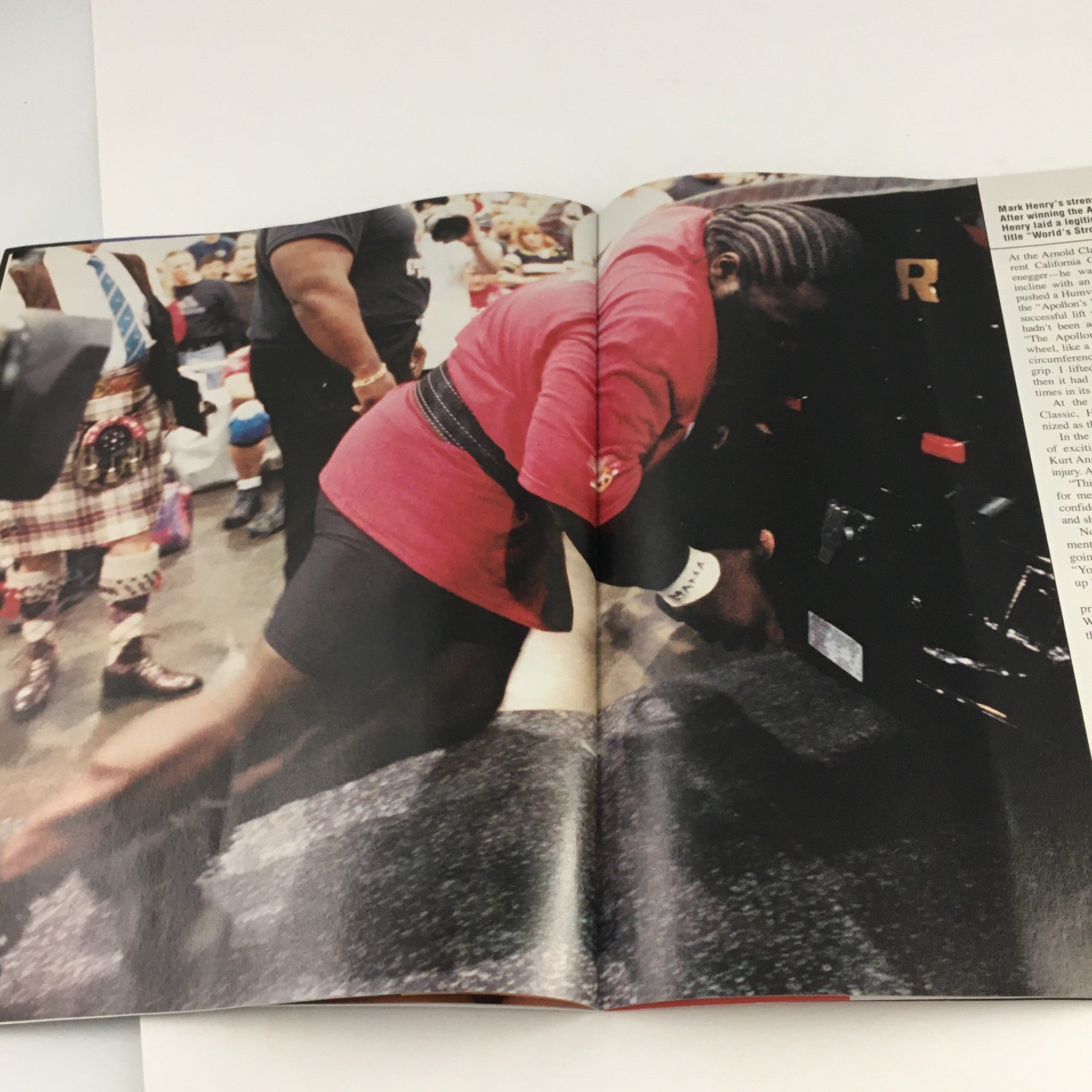 WWE Raw Magazine January 2004 featuring a dynamic image of Mark Henry in action during a match, showcasing his athleticism and strength.