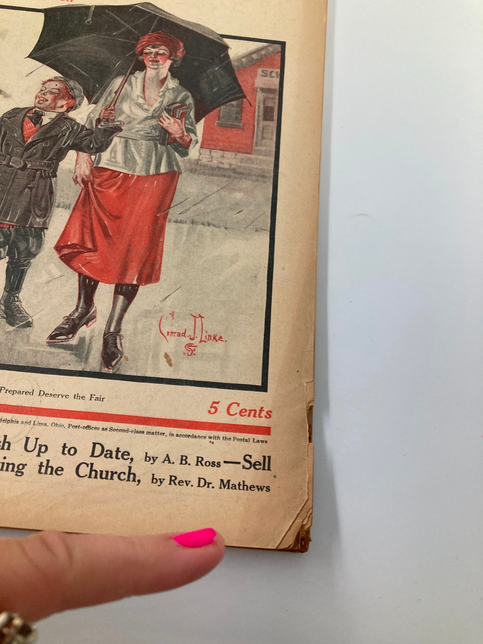 Cover illustration from VTG The Farm Journal Magazine November 1921 featuring a woman with an umbrella. The image showcases vintage fashion and advertisement content relevant to the historical agriculture context.