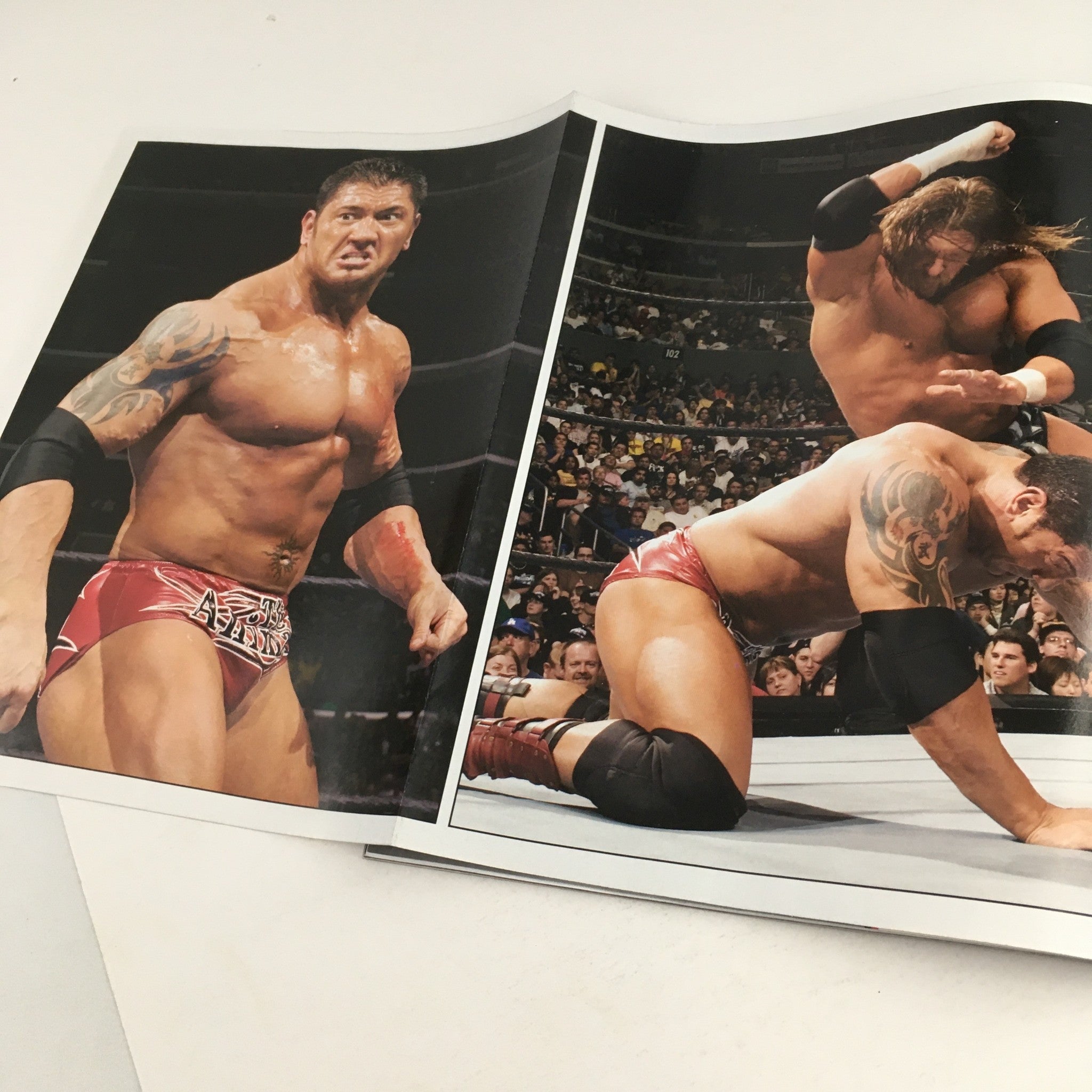 WWE Raw Magazine May 2005 displaying images of Batista during a wrestling match, emphasizing his powerful physique and athleticism.