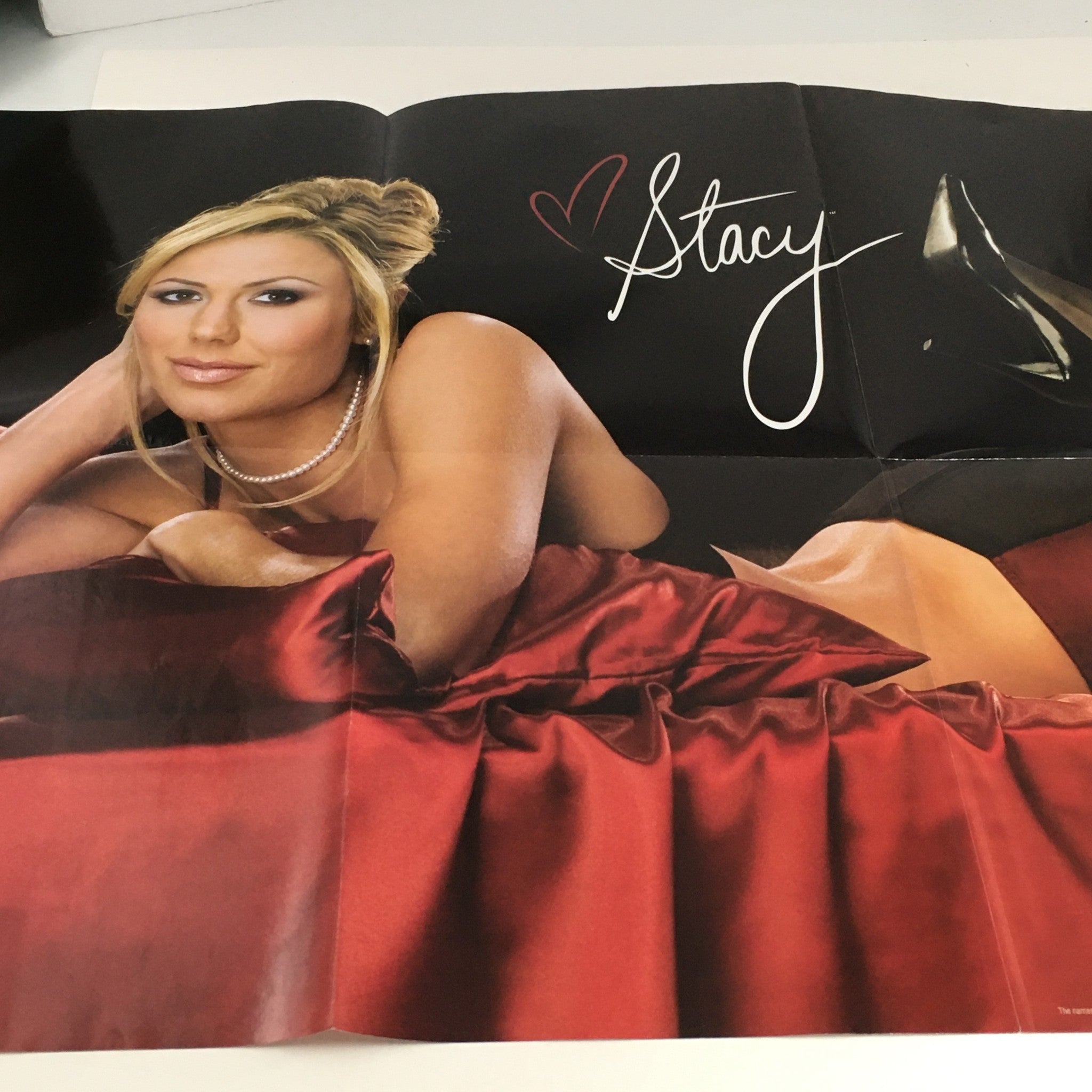 WWE Raw Magazine March 2005 poster of Stacy Keibler, adding collectible value to this vintage wrestling magazine.