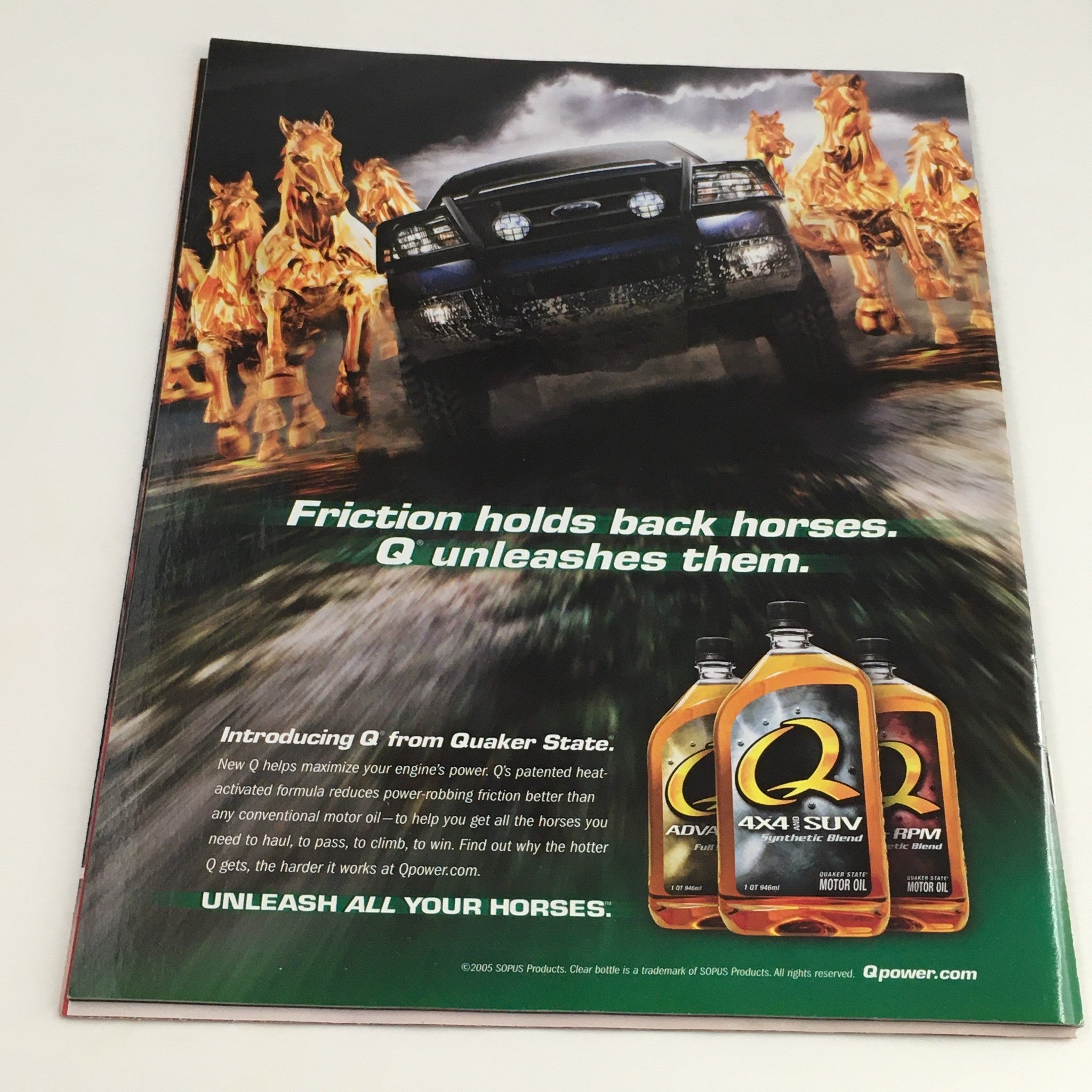 Back cover of WWE Raw Magazine March 2005 featuring an advertisement for Quaker State motor oil with a car and running horses, promoting the tagline 'Friction holds back horses. Q unleashes them.'