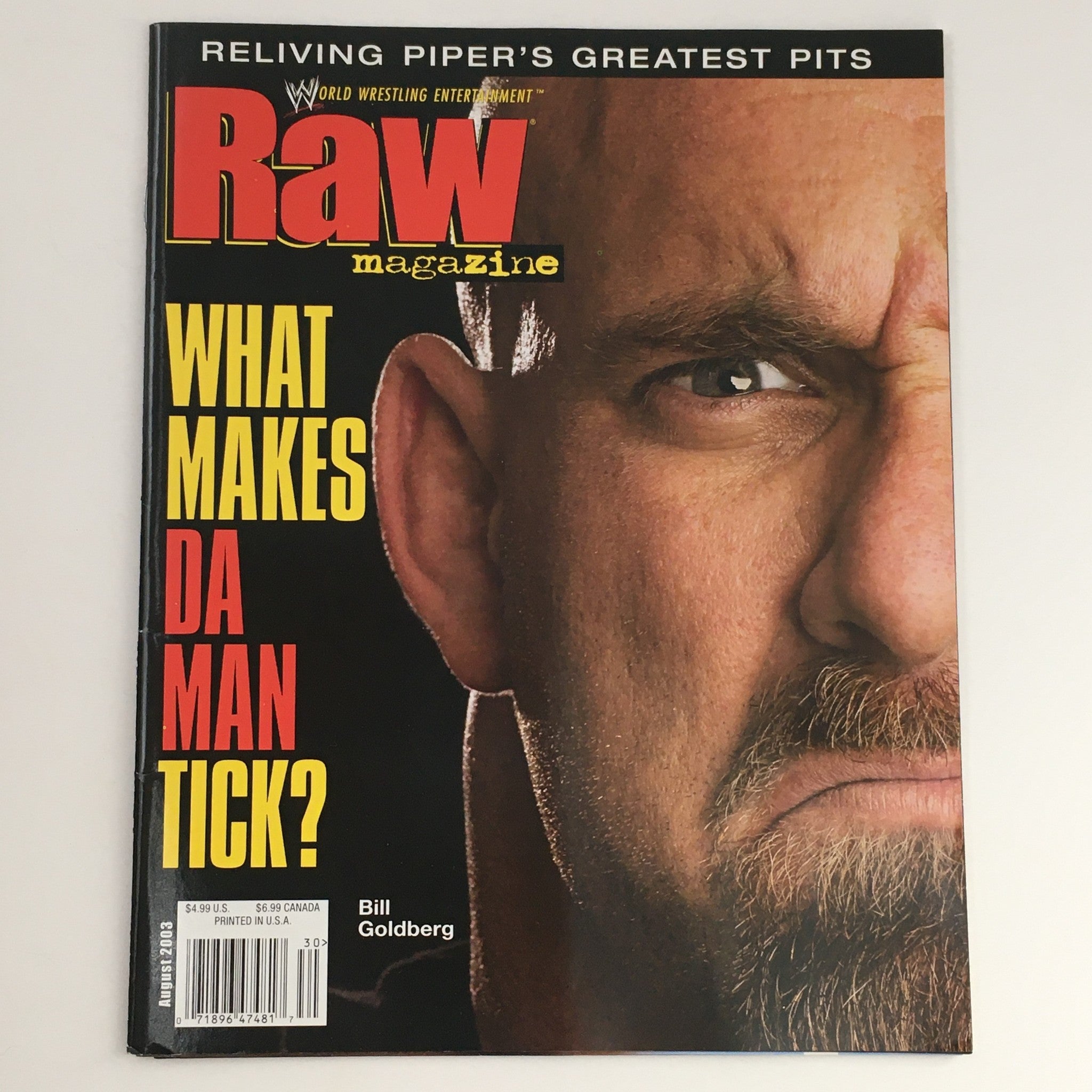 WWE Raw Magazine August 2003 featuring Bill Goldberg on the cover, with a striking expression and the question 'What Makes Da Man Tick?' highlighting the wrestling superstar.