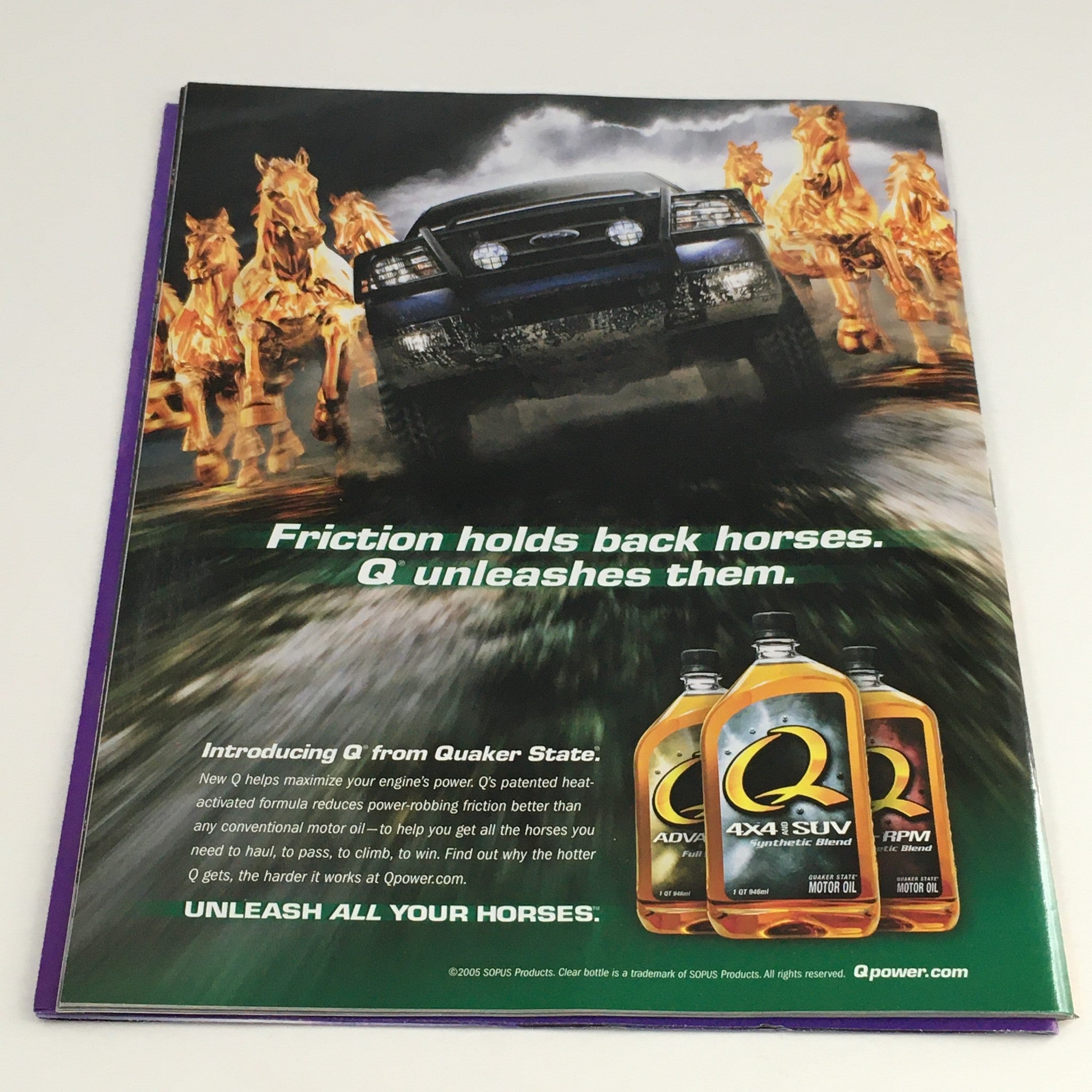 WWE Raw Magazine March 2005 back cover advertisement for Quaker State oil featuring a powerful SUV among running horses, emphasizing performance and strength.