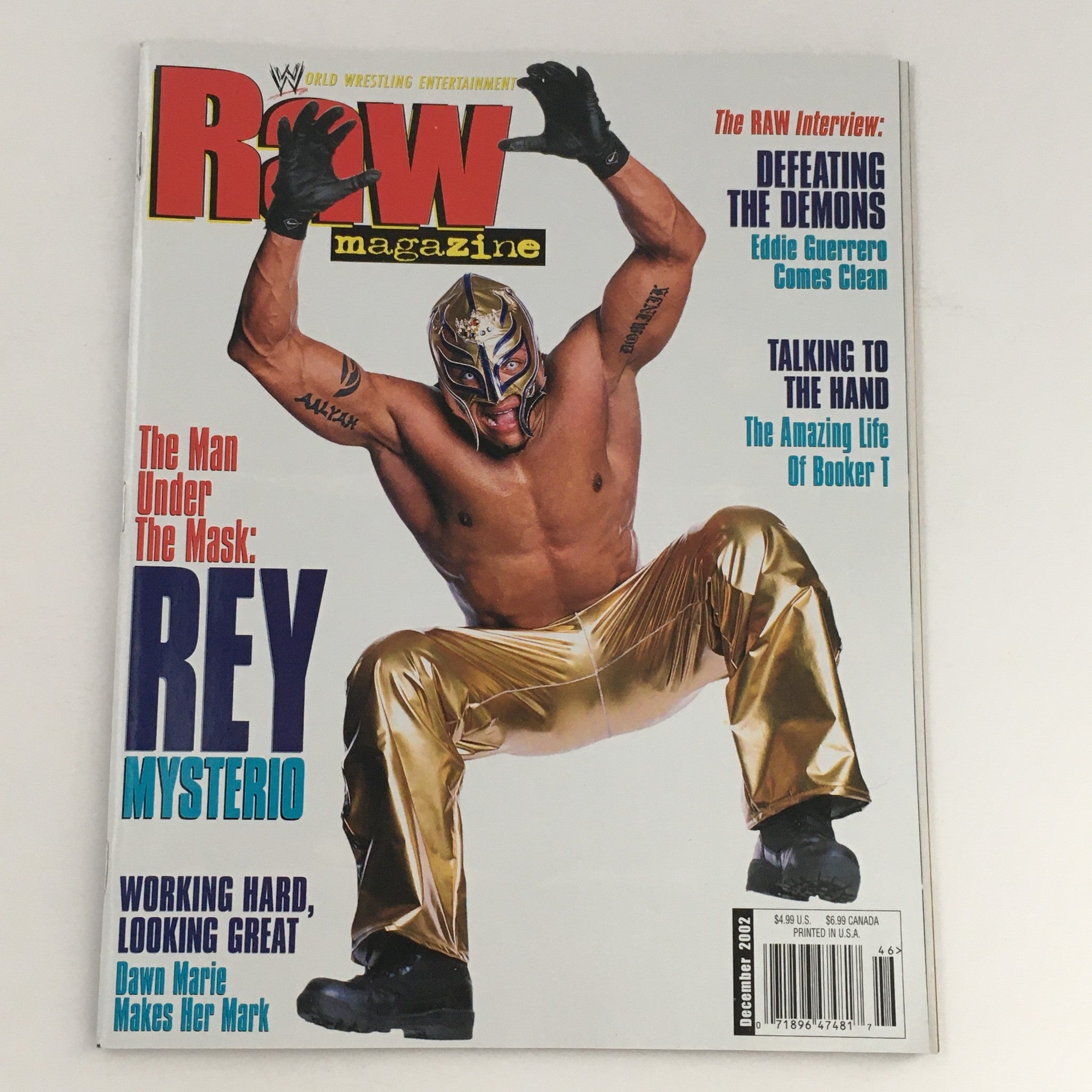 Cover of WWE Raw Magazine December 2002 featuring Rey Mysterio in wrestling attire, showcasing his signature high-flying style.