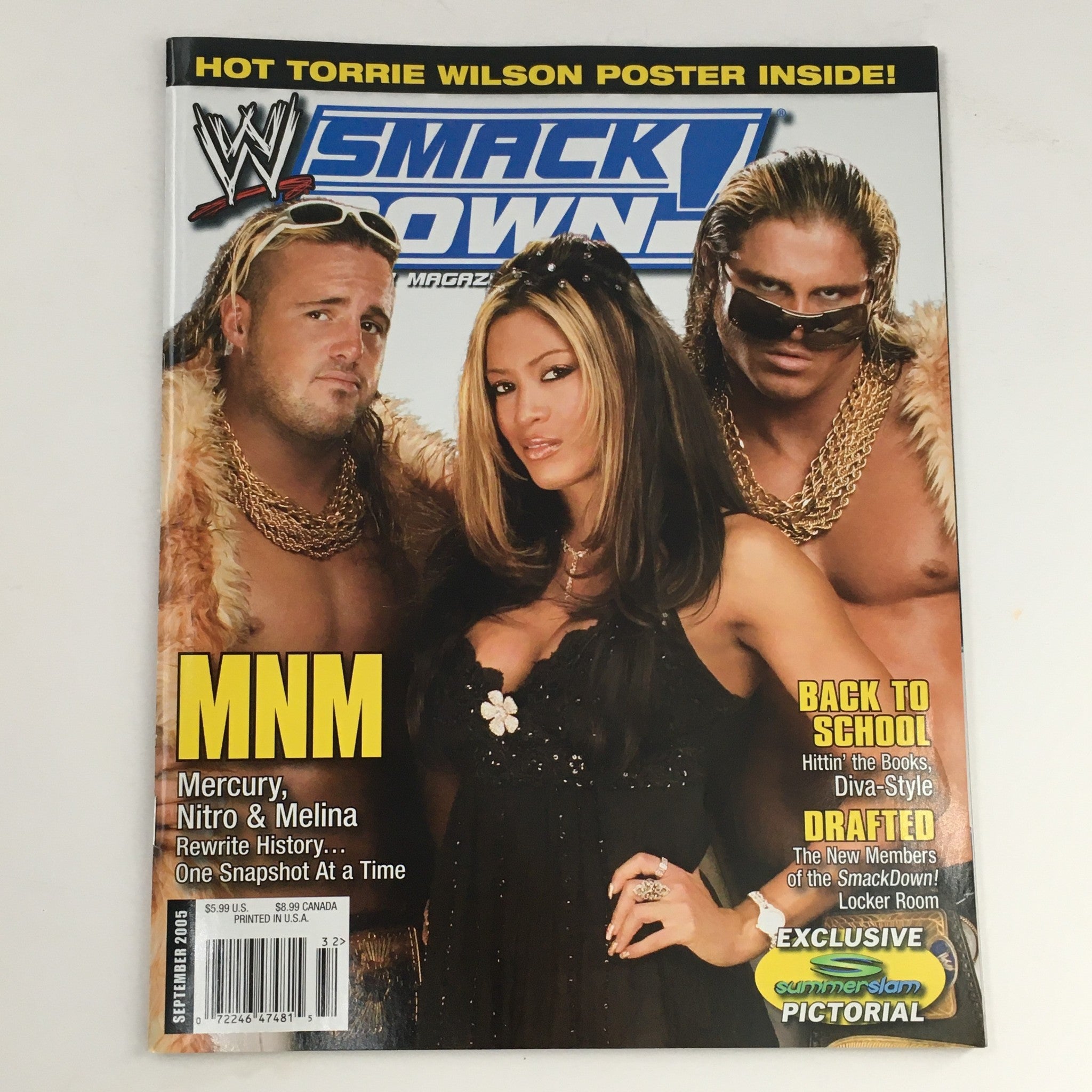 Cover of WWE Smack Down Magazine September 2005 featuring Mercury, Nitro, and Melina, with a mention of a hot Torrie Wilson poster inside. This vintage wrestling magazine is in very good condition and highlights the personalities that captivated fans during this era.
