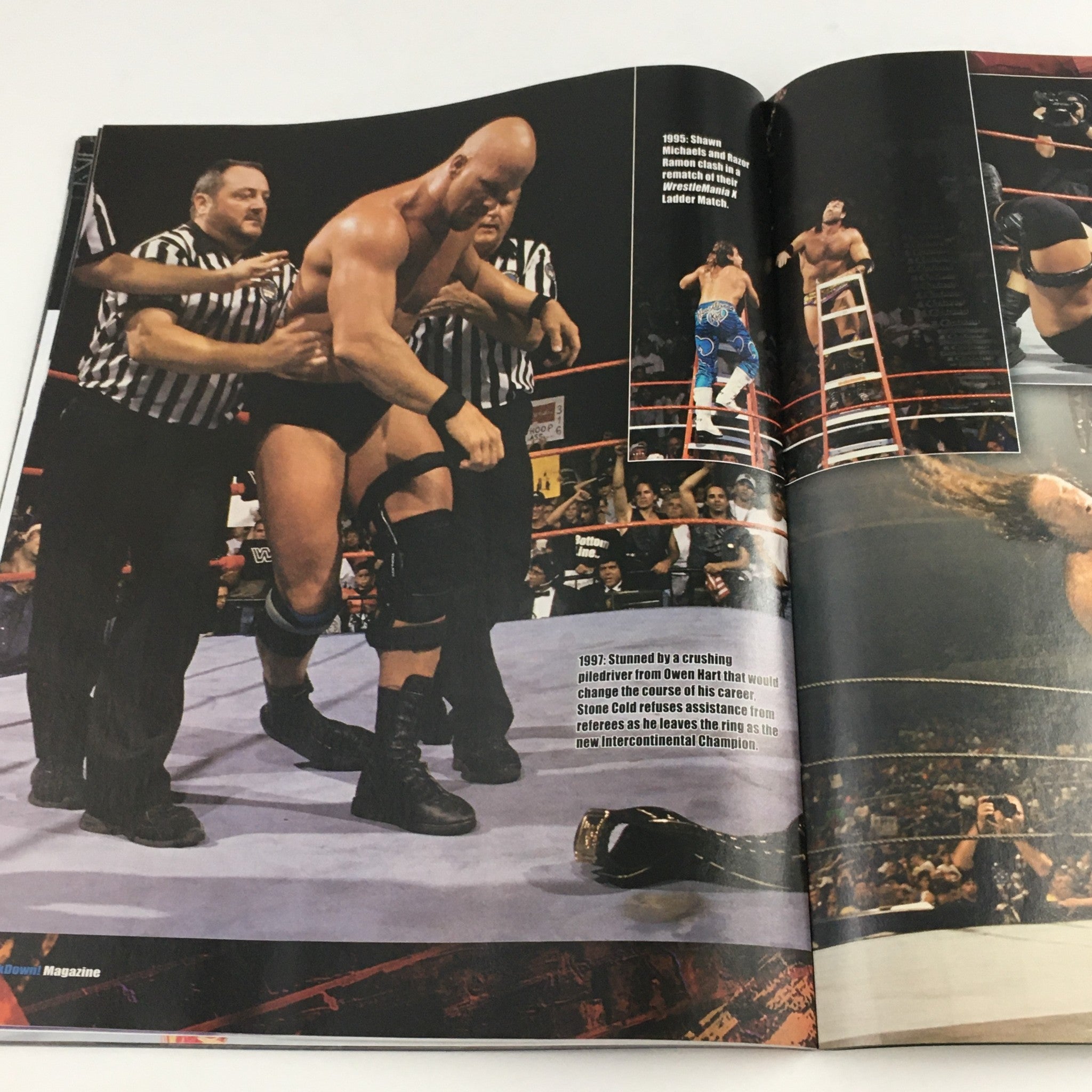 WWE Smack Down Magazine September 2005 depicting a wrestling match scene with wrestlers and referees, illustrating the intensity of professional wrestling action.