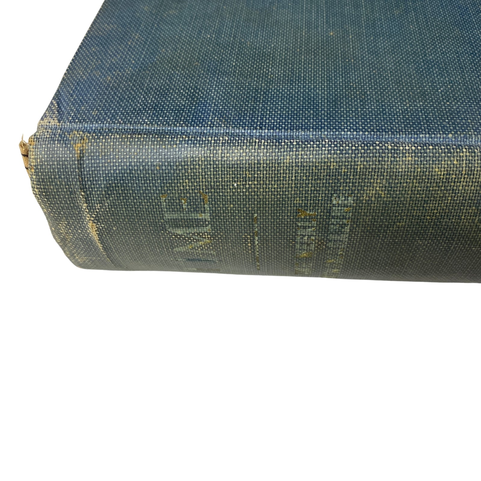 Close-up side view of the bound volume of Time Magazine July to December 1927, showing the wear and texture of the blue cover.