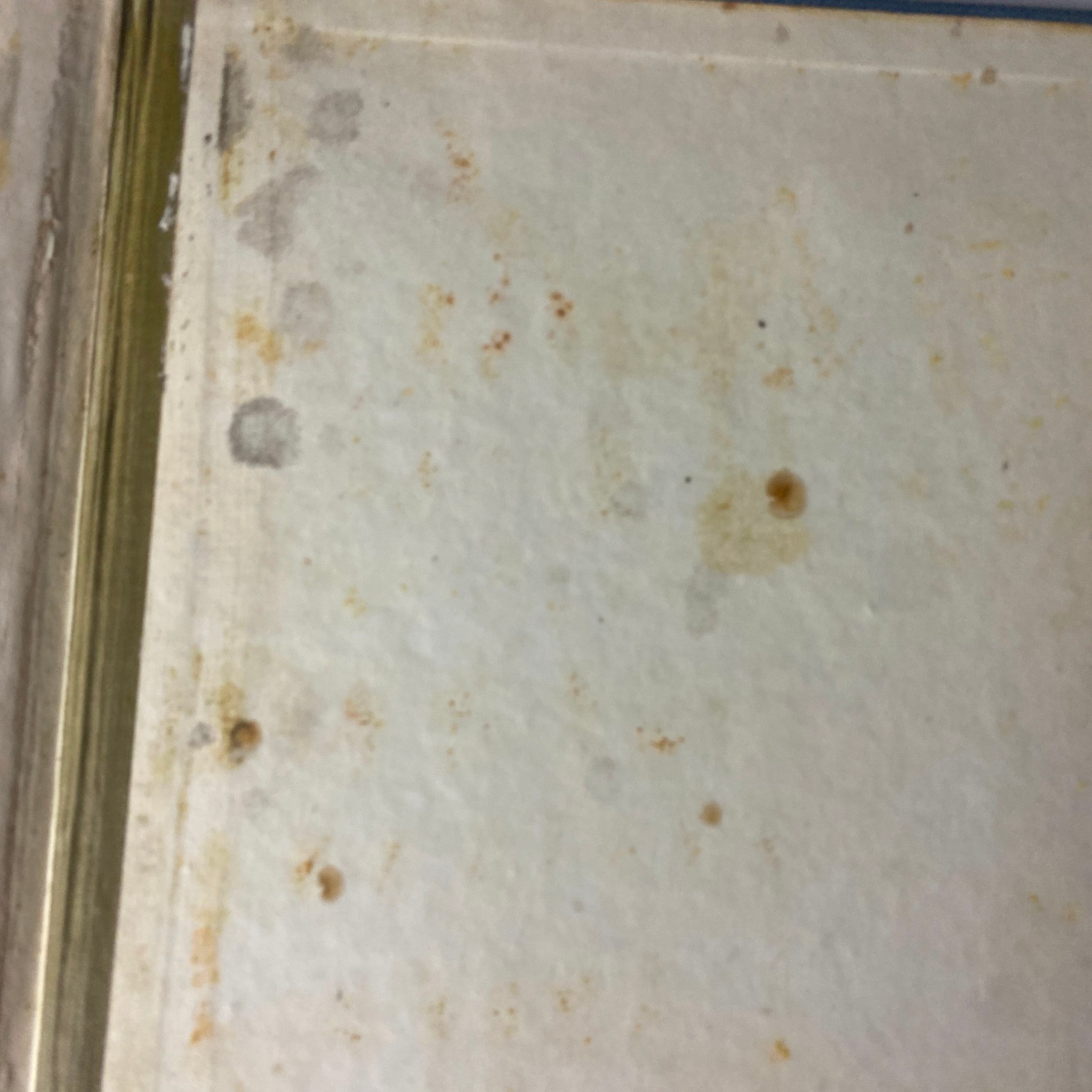 Close-up view of the interior of the Time Magazine Bound Weekly 1927 July - December, showing wear and stains on the paper.