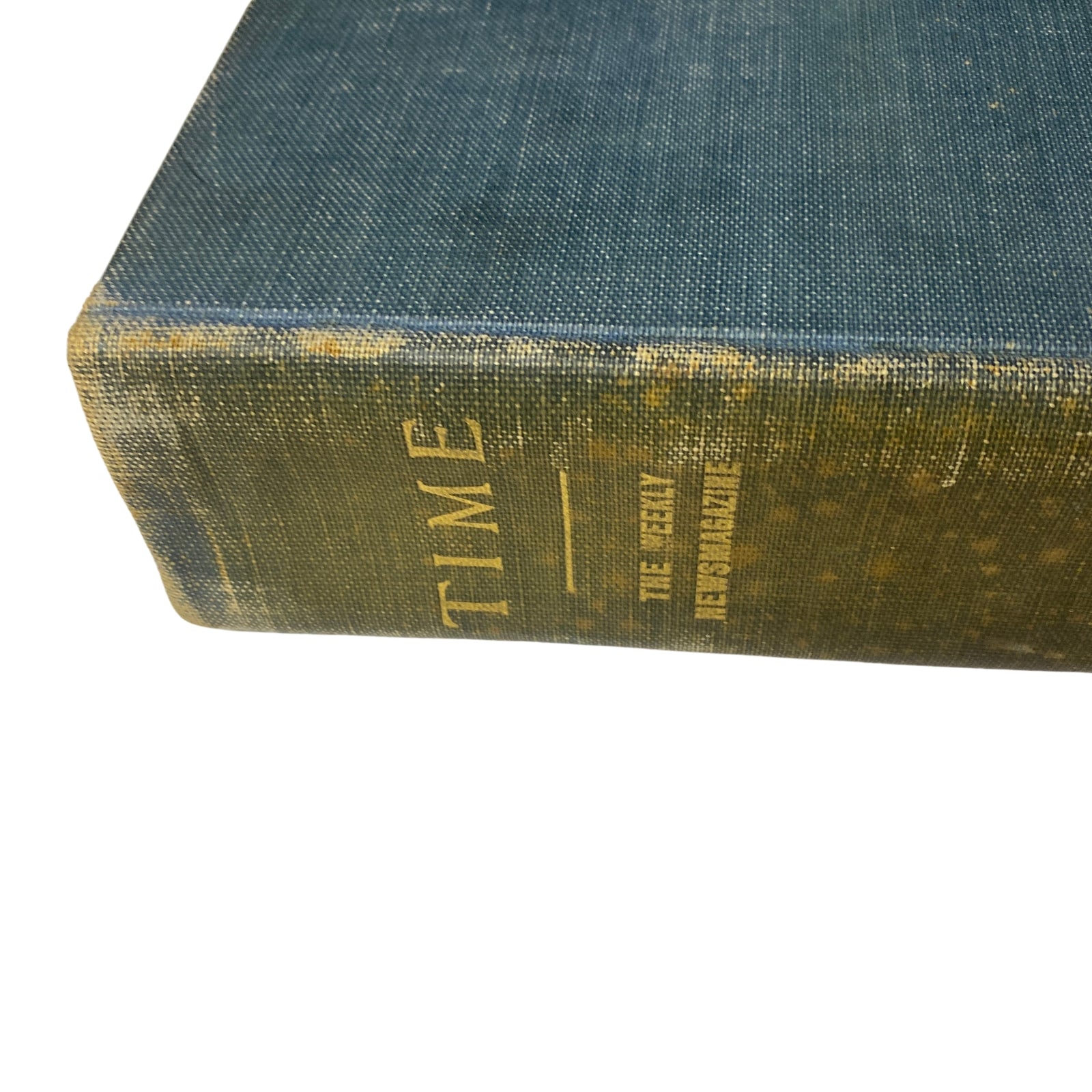 Close-up of the spine of the Time Magazine Bound Weekly, featuring the title and year, indicating its historical significance.