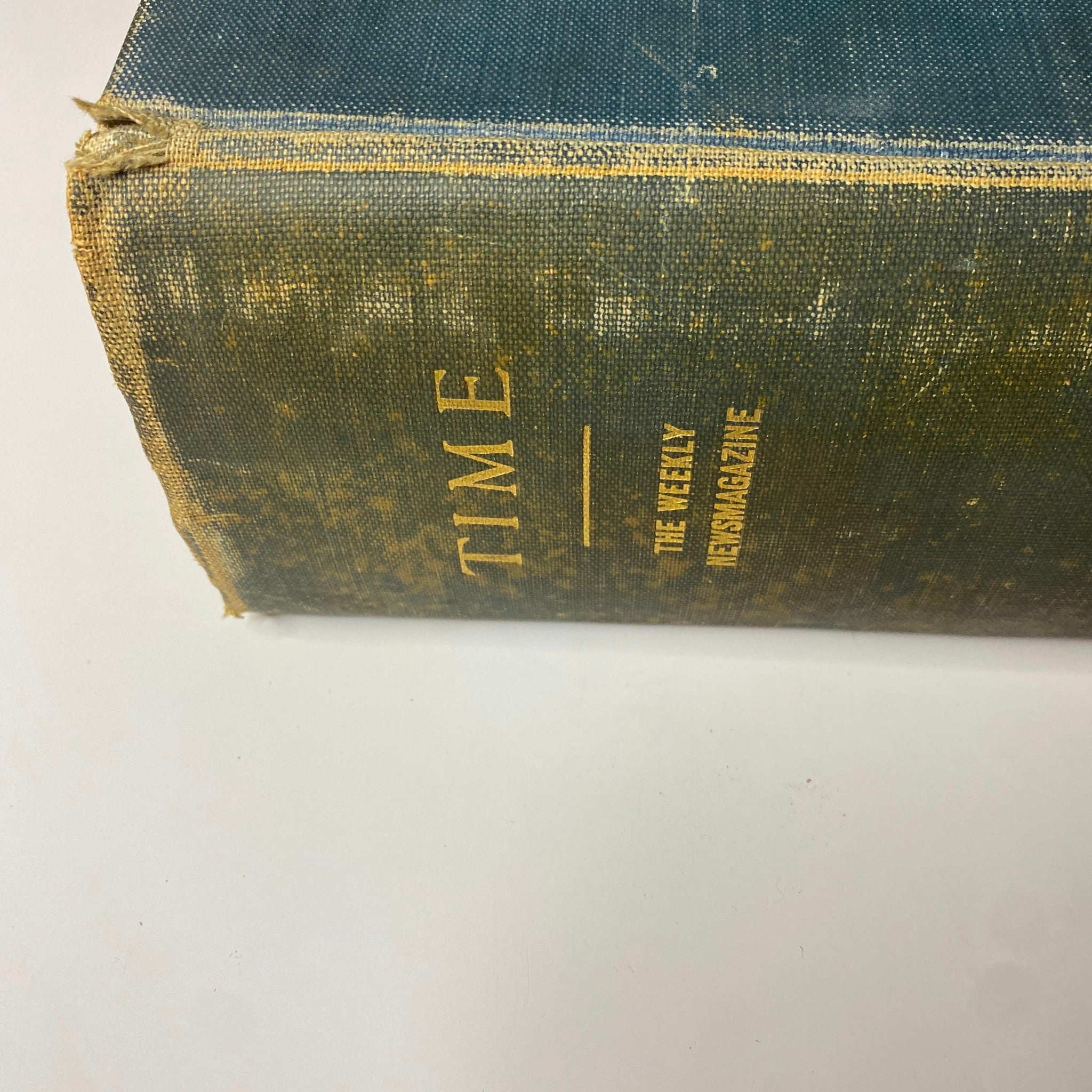 Spine of 'Time Magazine Bound Weekly January 6, 1930 - June 30, 1930' showing the book's title in gold lettering on a worn cover.