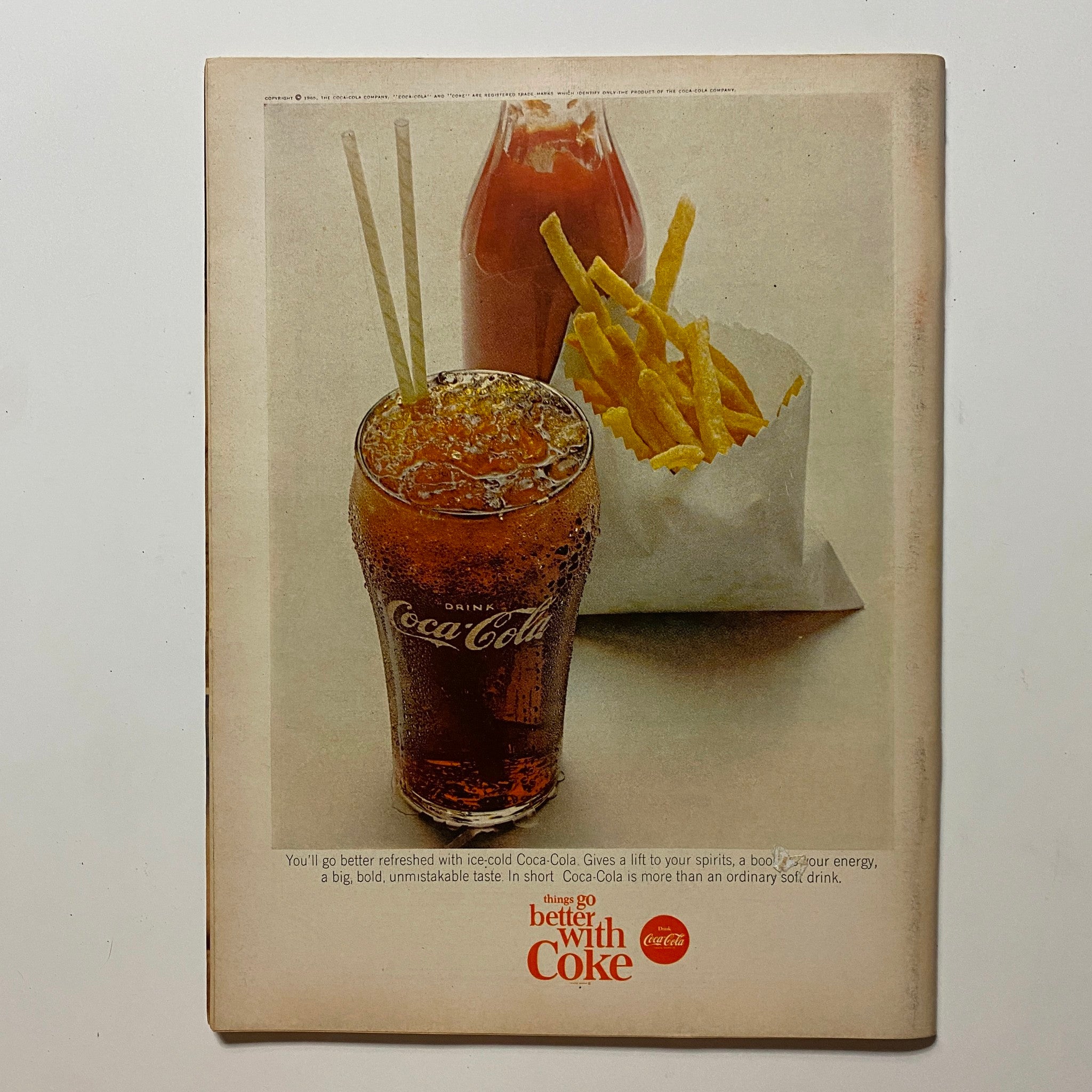 Back cover of VTG Hot Rod Magazine September 1965 featuring a vintage Coca-Cola advertisement, demonstrating the nostalgic charm of mid-20th century advertising.