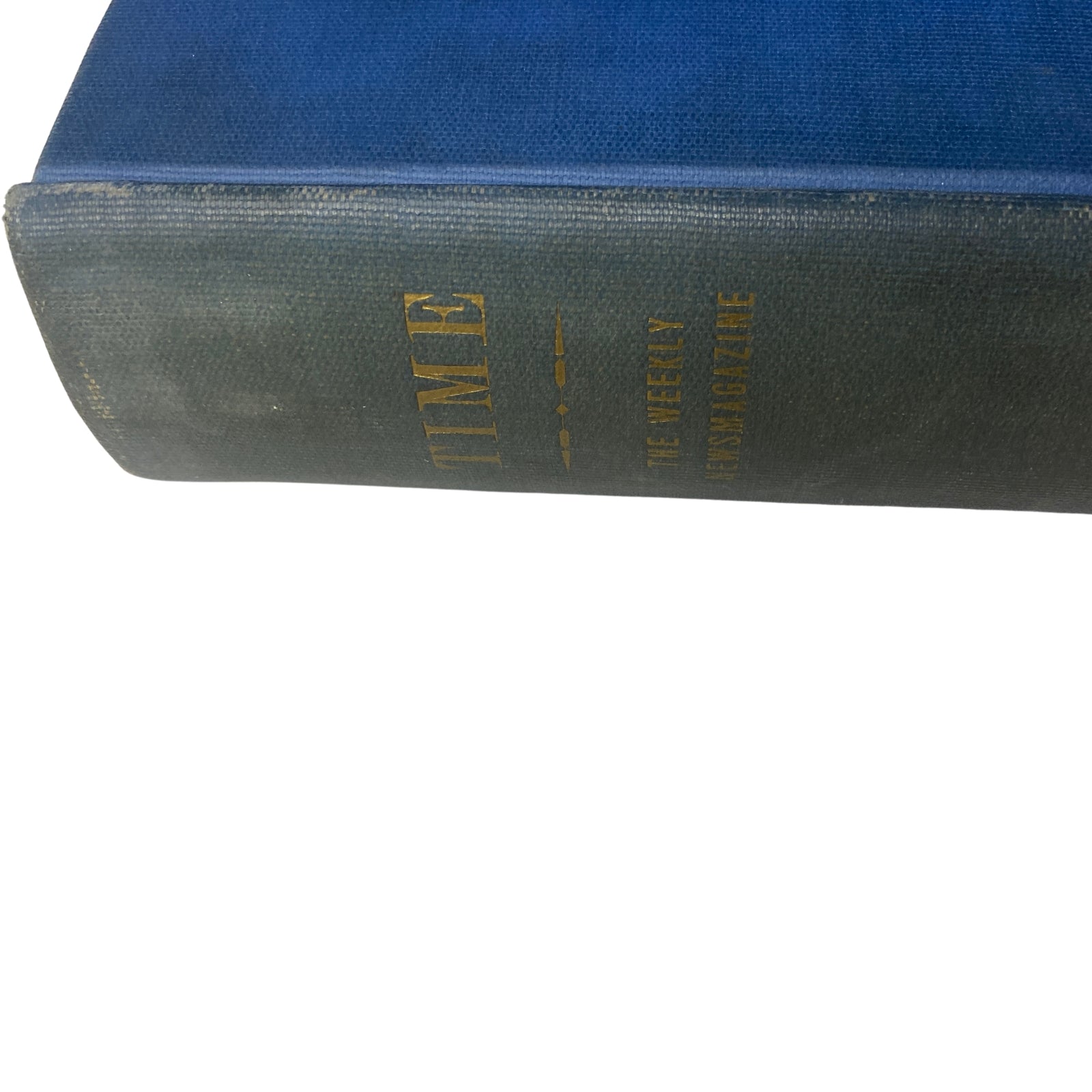 Detailed side view of the Time Magazine bound volume, showing its blue and green fabric texture - Time Magazine Library Bound October 1-December 31, 1934 Thomas Benton.