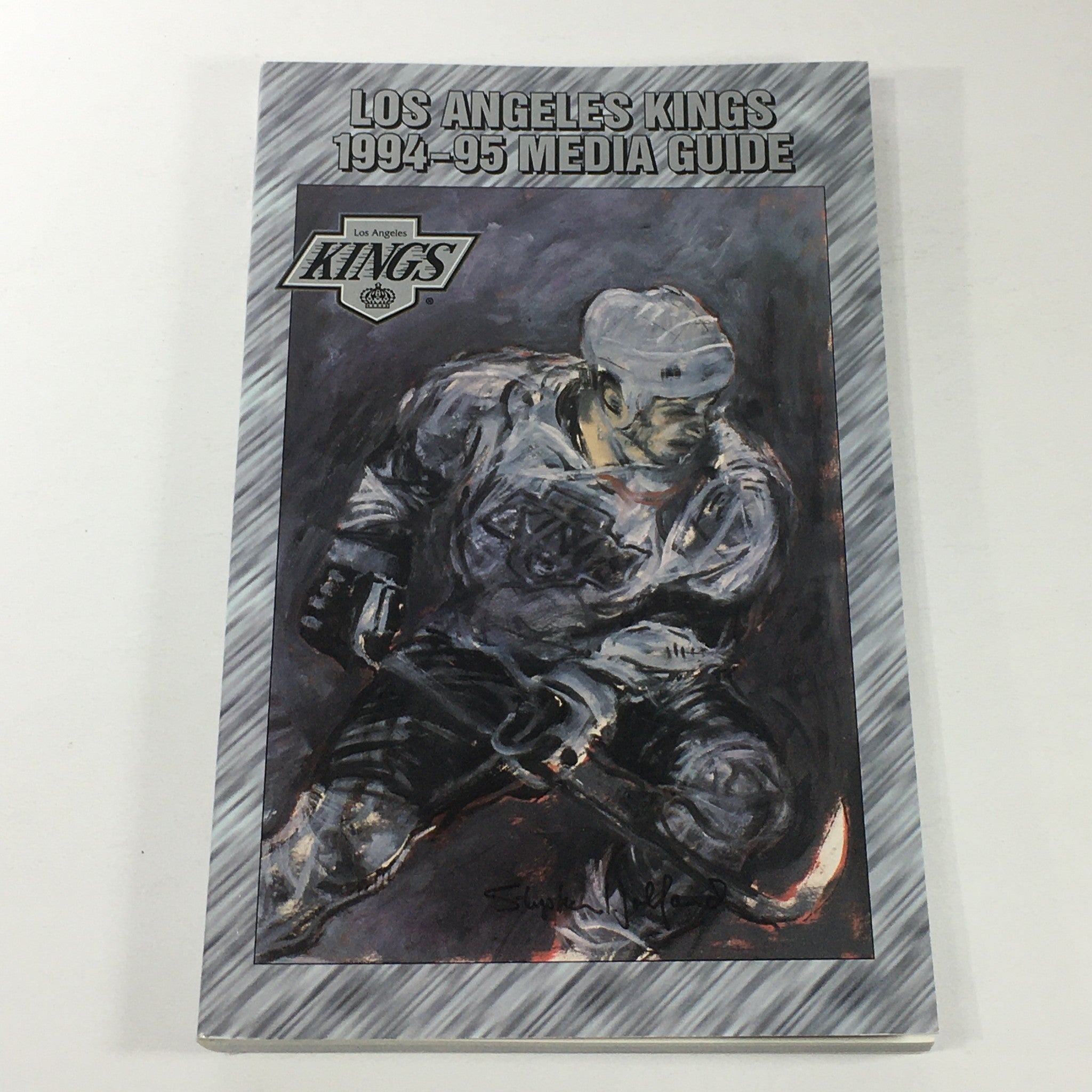 VTG NHL Official Media Guide 1994-1995 - Los Angeles Kings cover featuring an artistic depiction of a player on the ice.