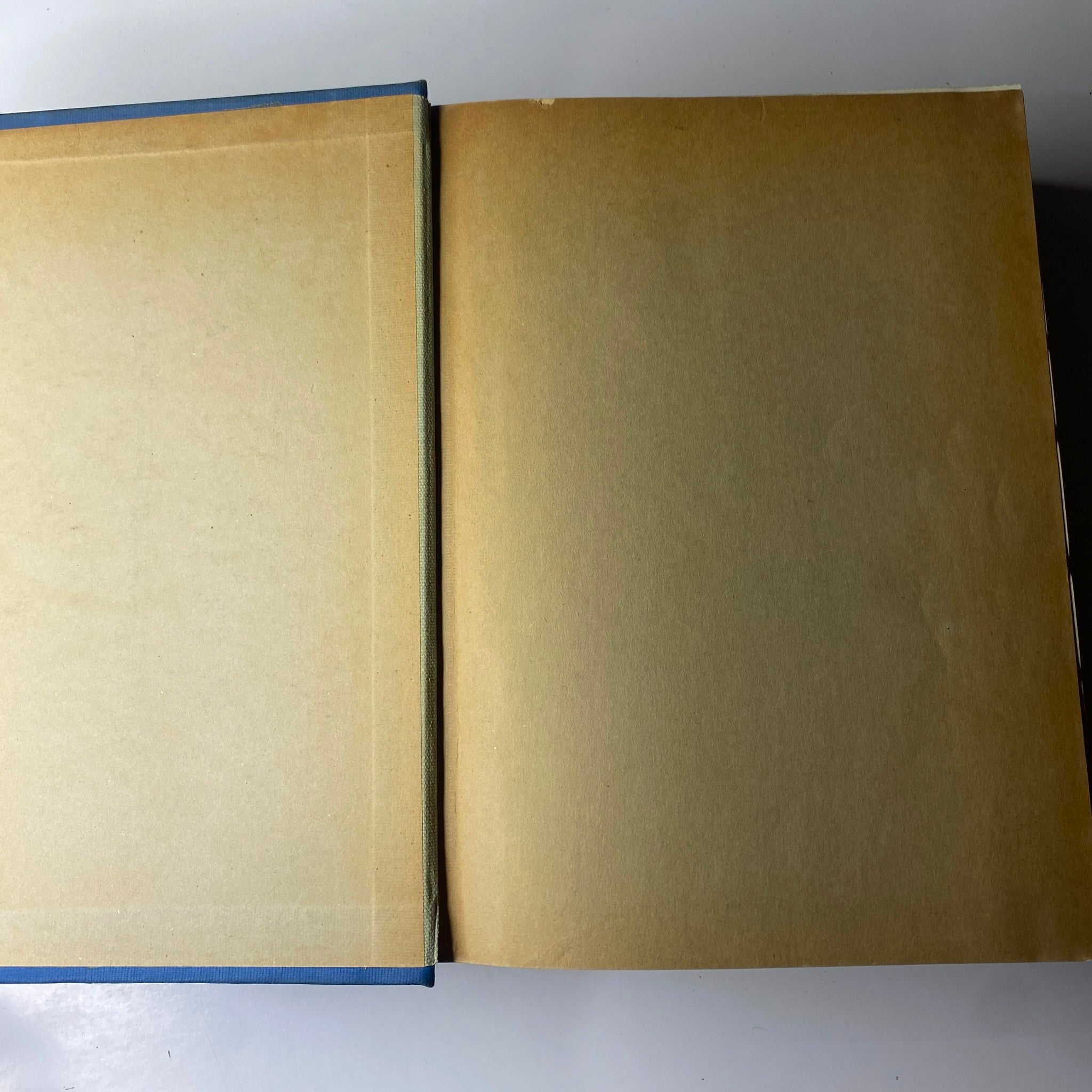 Inside cover of Time Magazine Library Bound April 5- June 28, 1937, displaying an empty page with light brown paper.