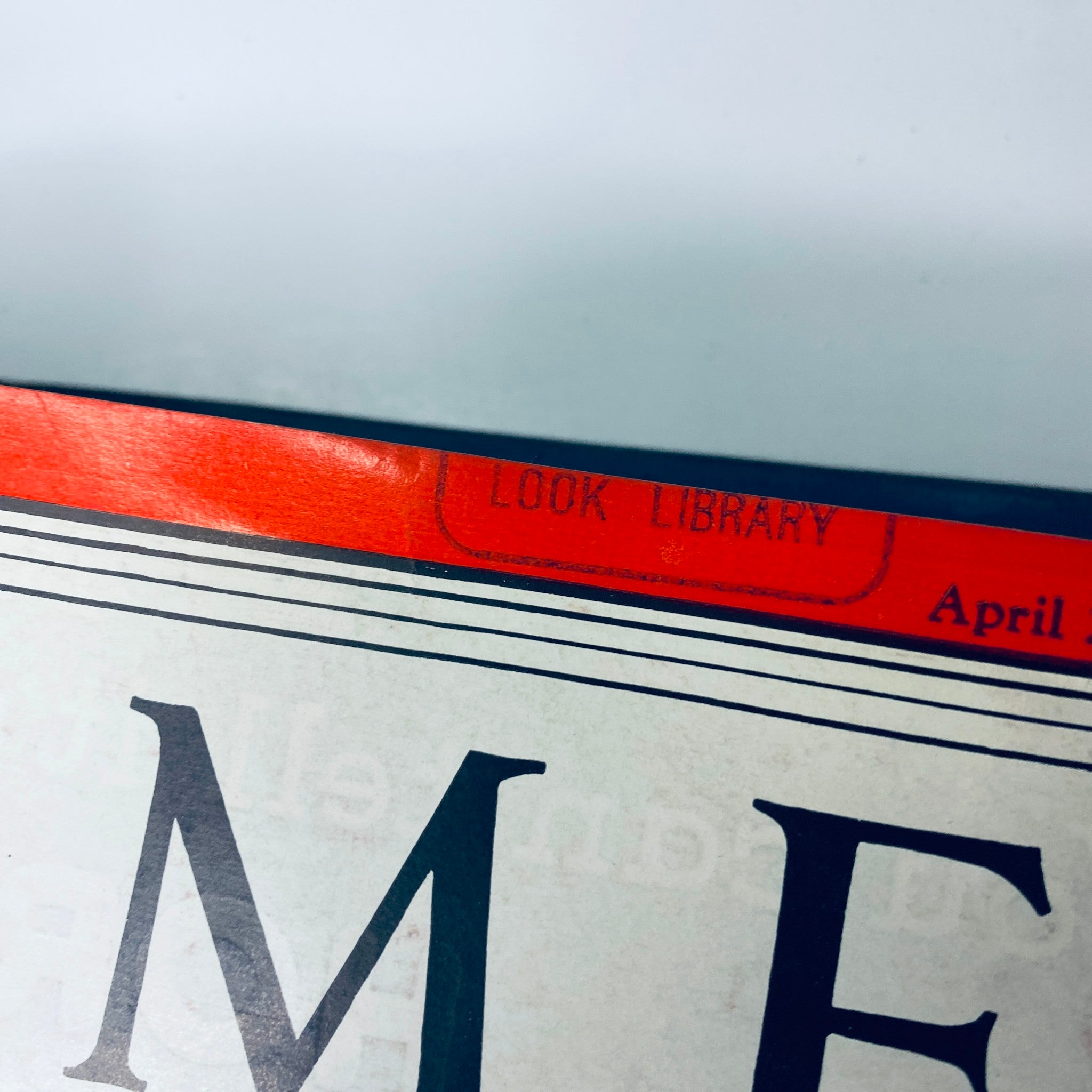 Close-up of the top edge of Time Magazine Library Bound April 5- June 28, 1937, displaying the 'Look Library' stamp.