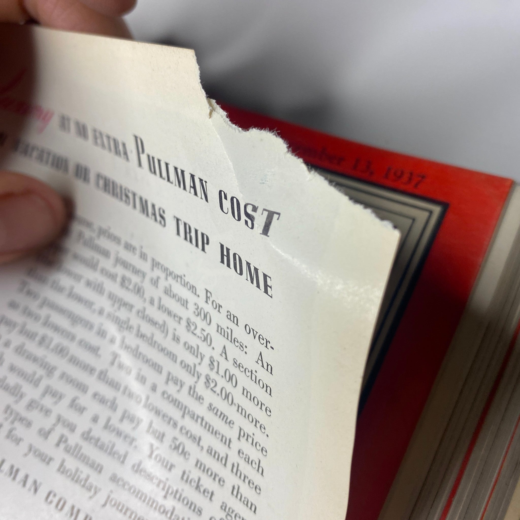 Close-up of a damaged page from the Time Magazine 1937 July-Dec Bound featuring a discussion on Pullman costs for Christmas trips.