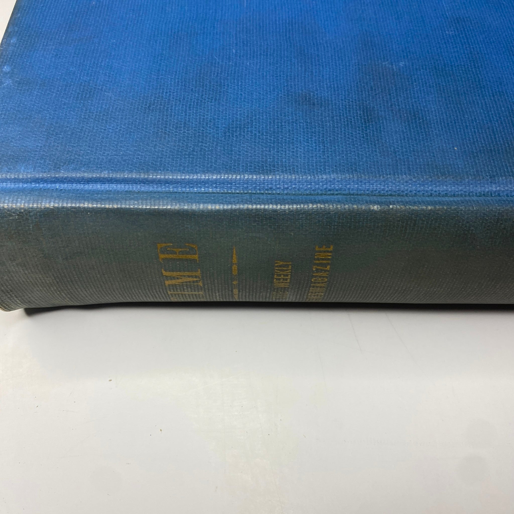 Close-up side view of the blue hardcover of the Time Magazine bound volume, highlighting the spine and title as part of the Time Magazine Albert Einstein 1938 Reza Shah Pahlavi April-June Bound Volume.