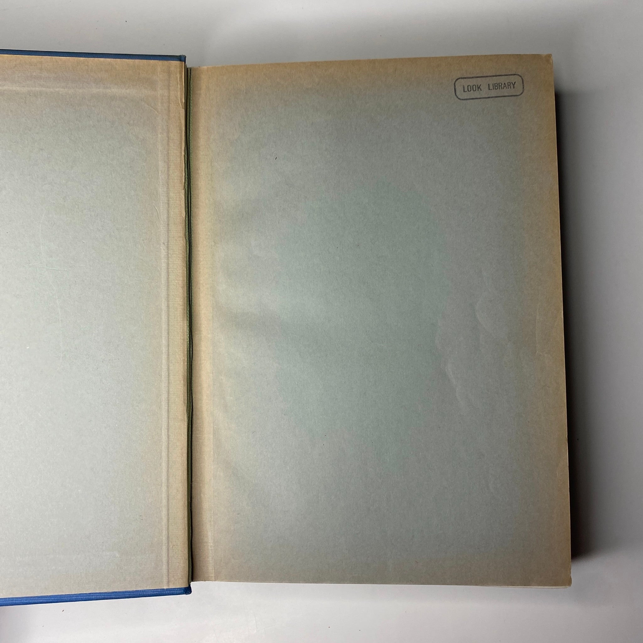 Inside view of the Time Magazine Albert Einstein 1938 bound volume revealing the library label on the inner cover, showing its archival status.