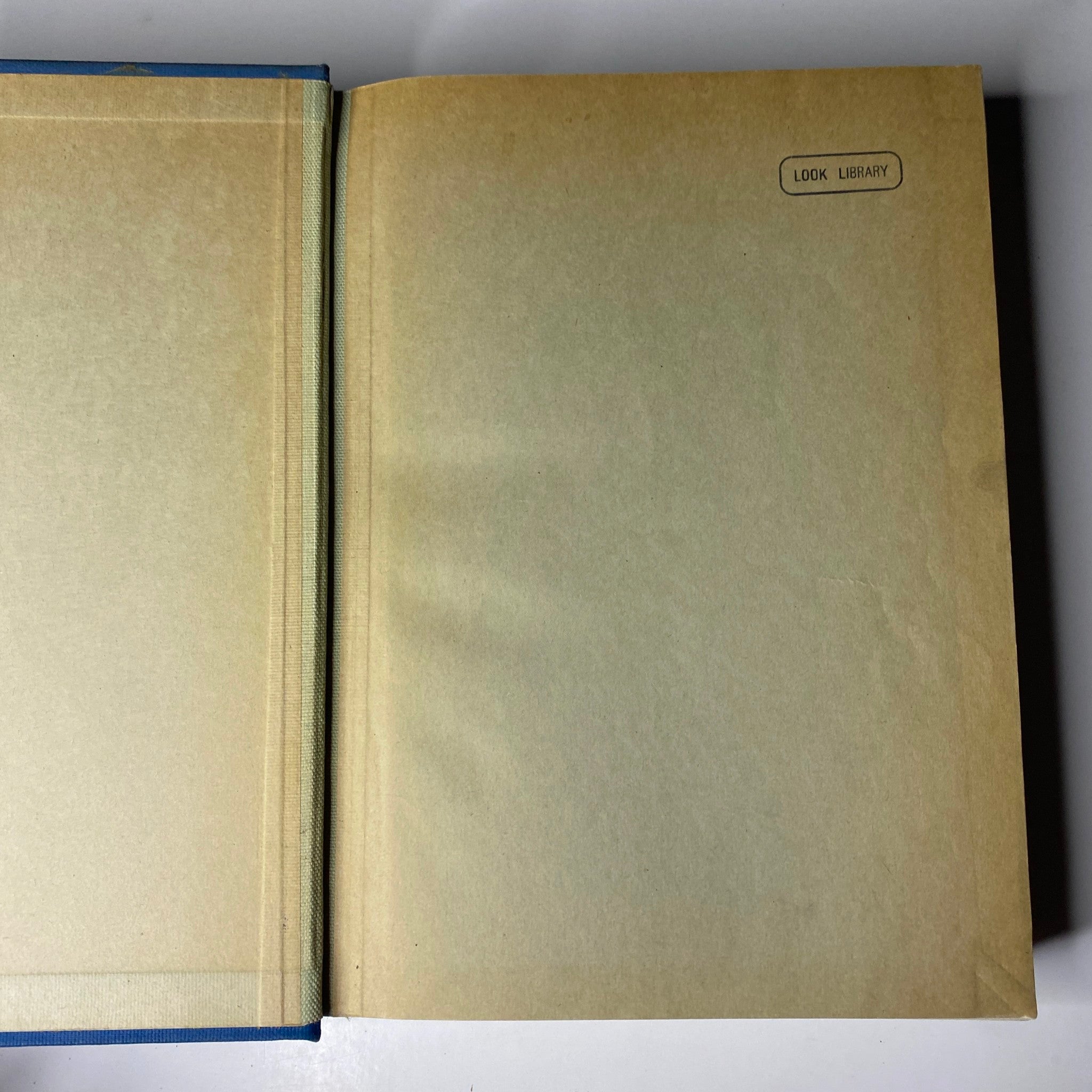 Interior view of the library-bound volume featuring the 'Look Library' stamp, from 'Time Magazine Library Bound July 1-September 30, 1935'.
