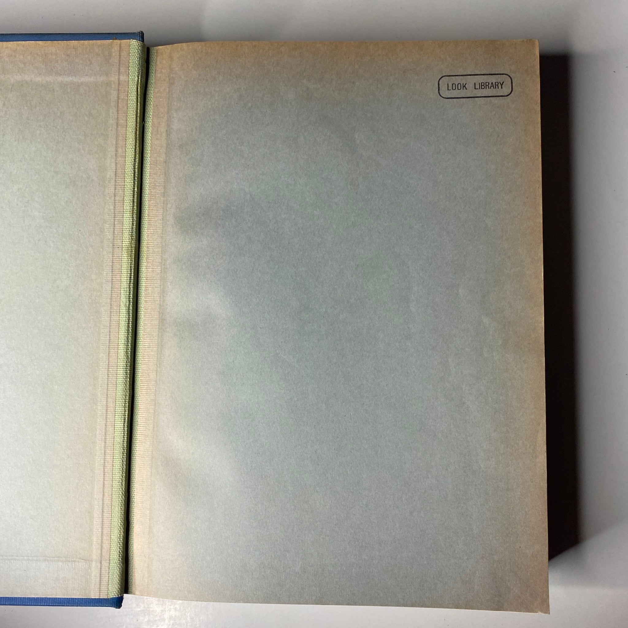Time Magazine Library Bound October 7- December 30, 1935 - Interior view of the first page showing protective cover and library stamp.