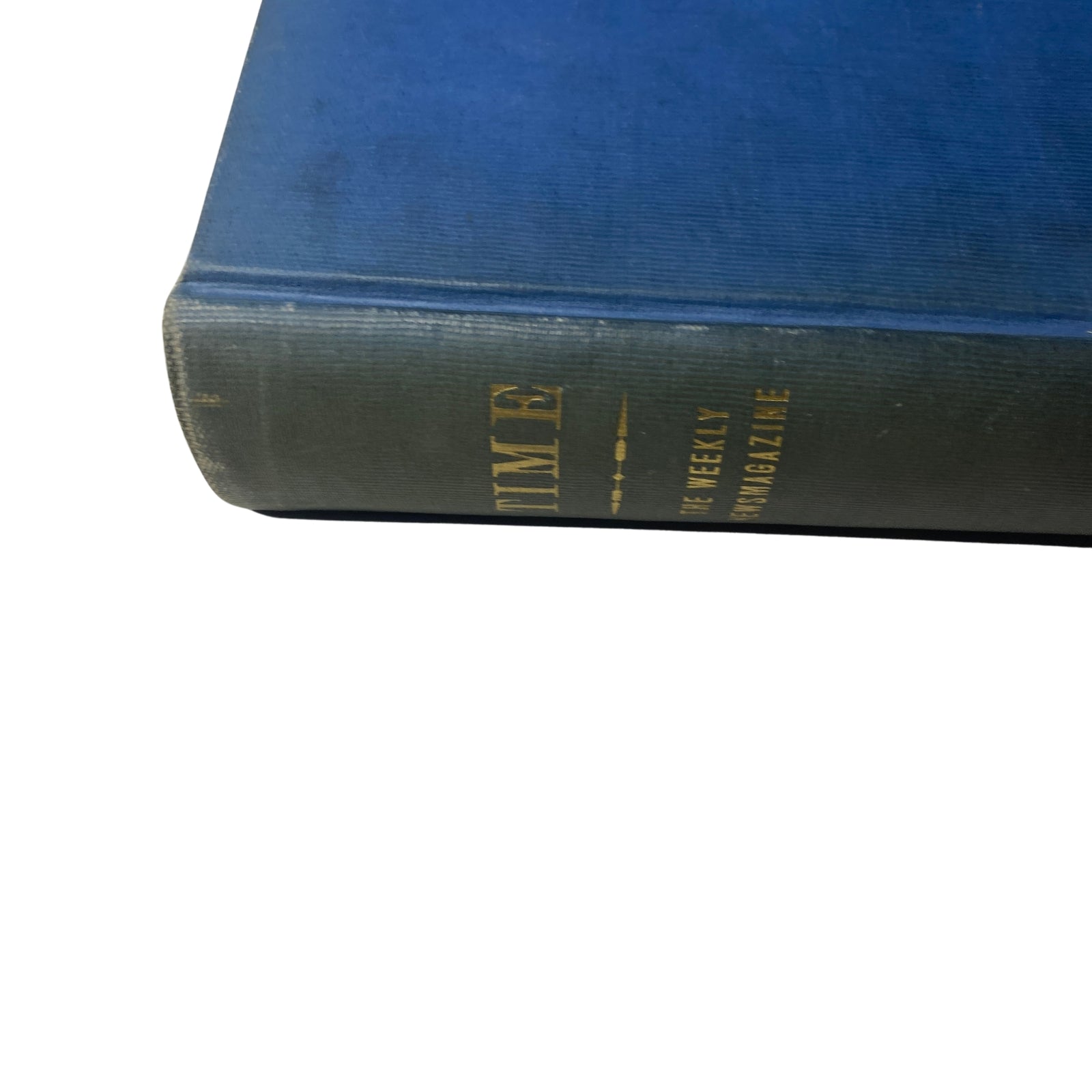 Close-up of the spine of Time Magazine Library Bound edition, with gold lettering indicating it is the Weekly Magazine volume 25.