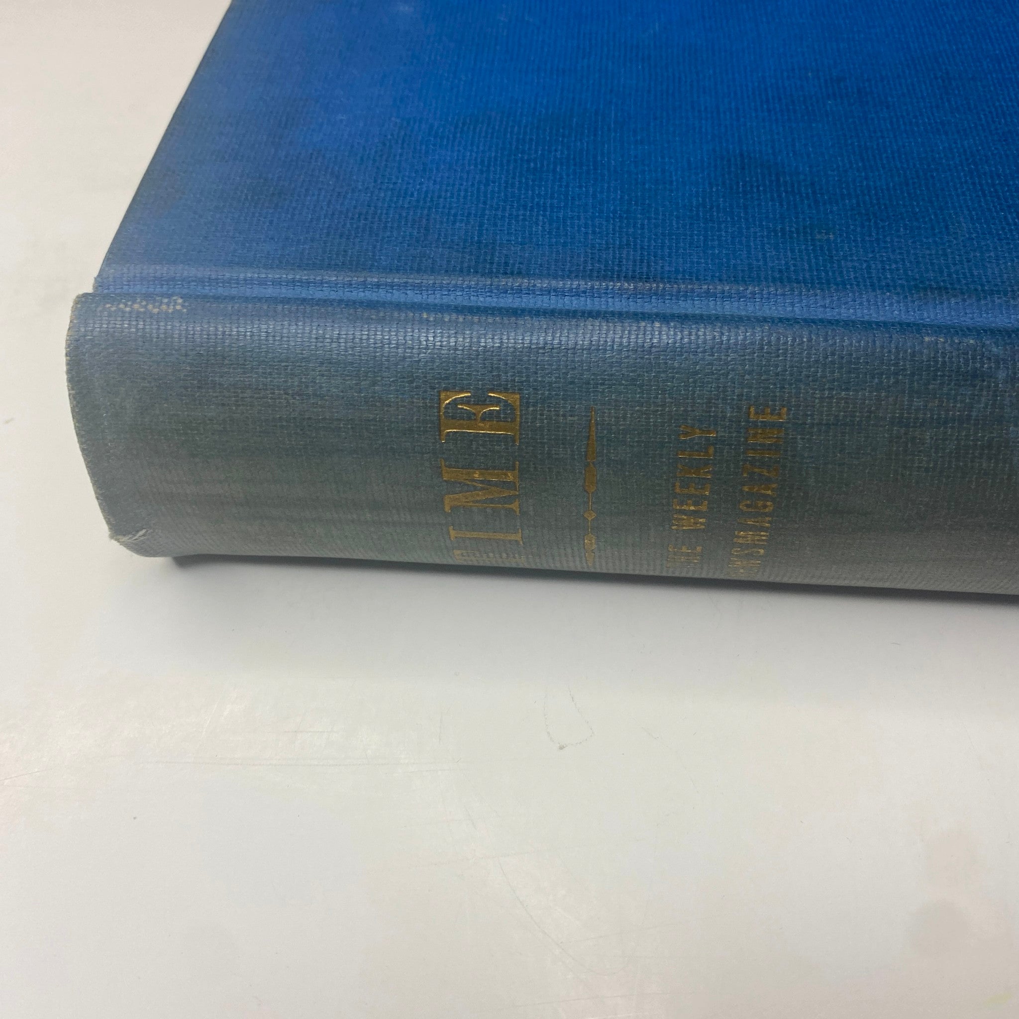 Close-up view of the spine of the Time Magazine Library Bound volume January-March 27, 1939, showcasing the title 'TIME' printed in gold on a textured blue background.