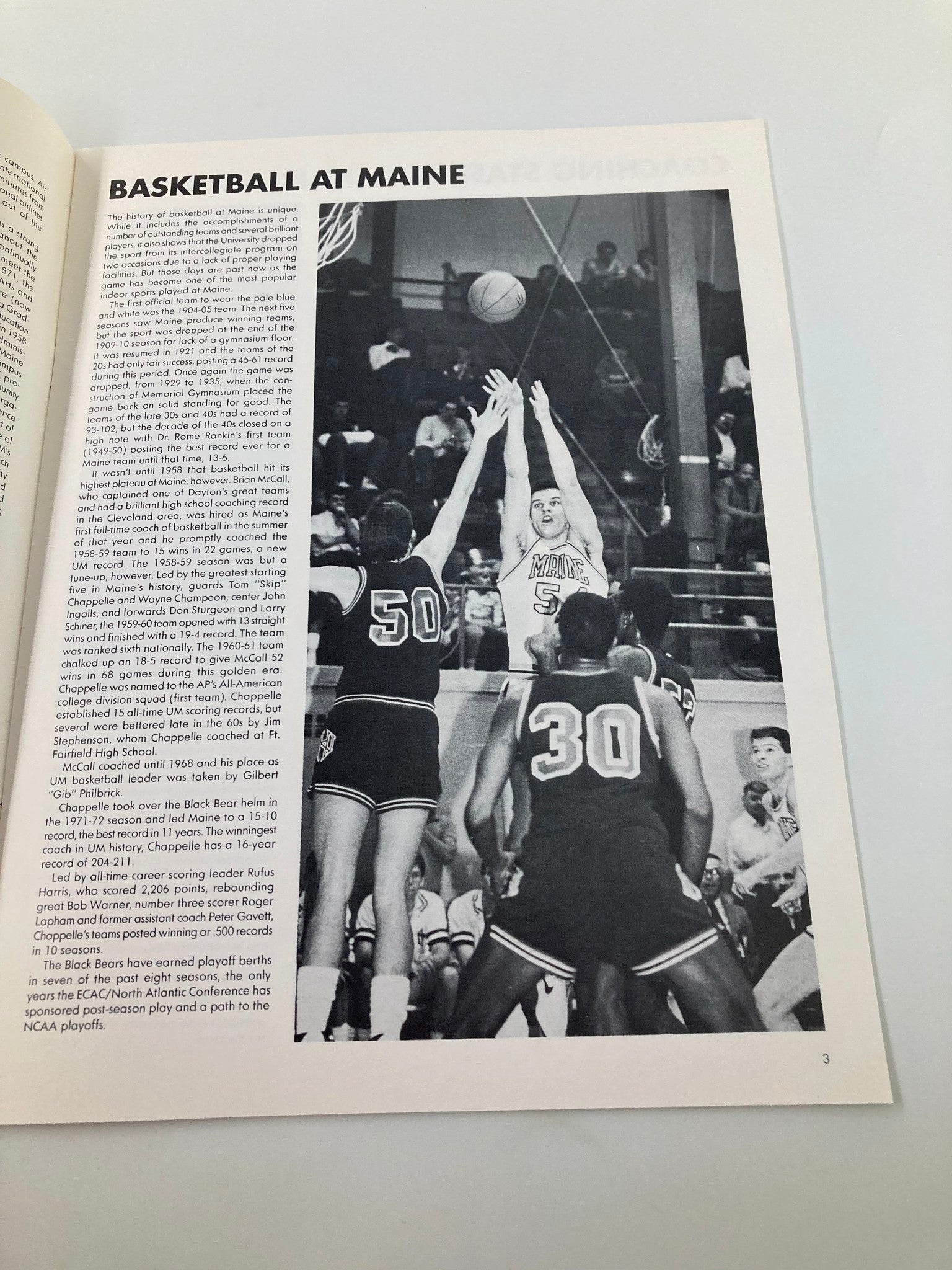 Basketball action scene from the VTG 1987-1988 University of Maine Basketball Yearbook featuring the Maine Black Bears, illustrating the spirit of college basketball.