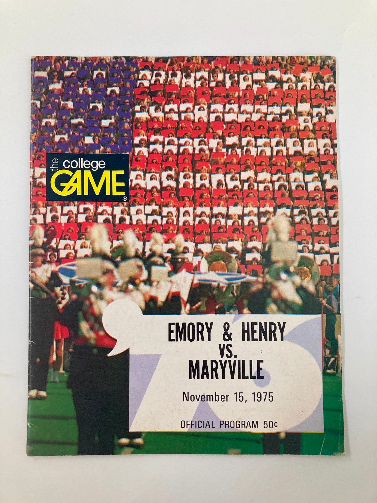 Cover of the November 15 1975 College Game Official Program featuring Emory & Henry vs Maryville, showcasing vibrant colors with a crowd background and marching band.