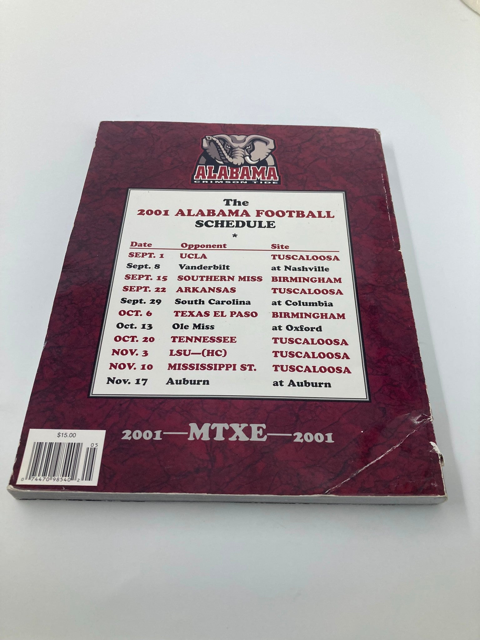 Back cover of the 2001 Alabama Crimson Tide Football Official Program listing the football schedule for the season.
