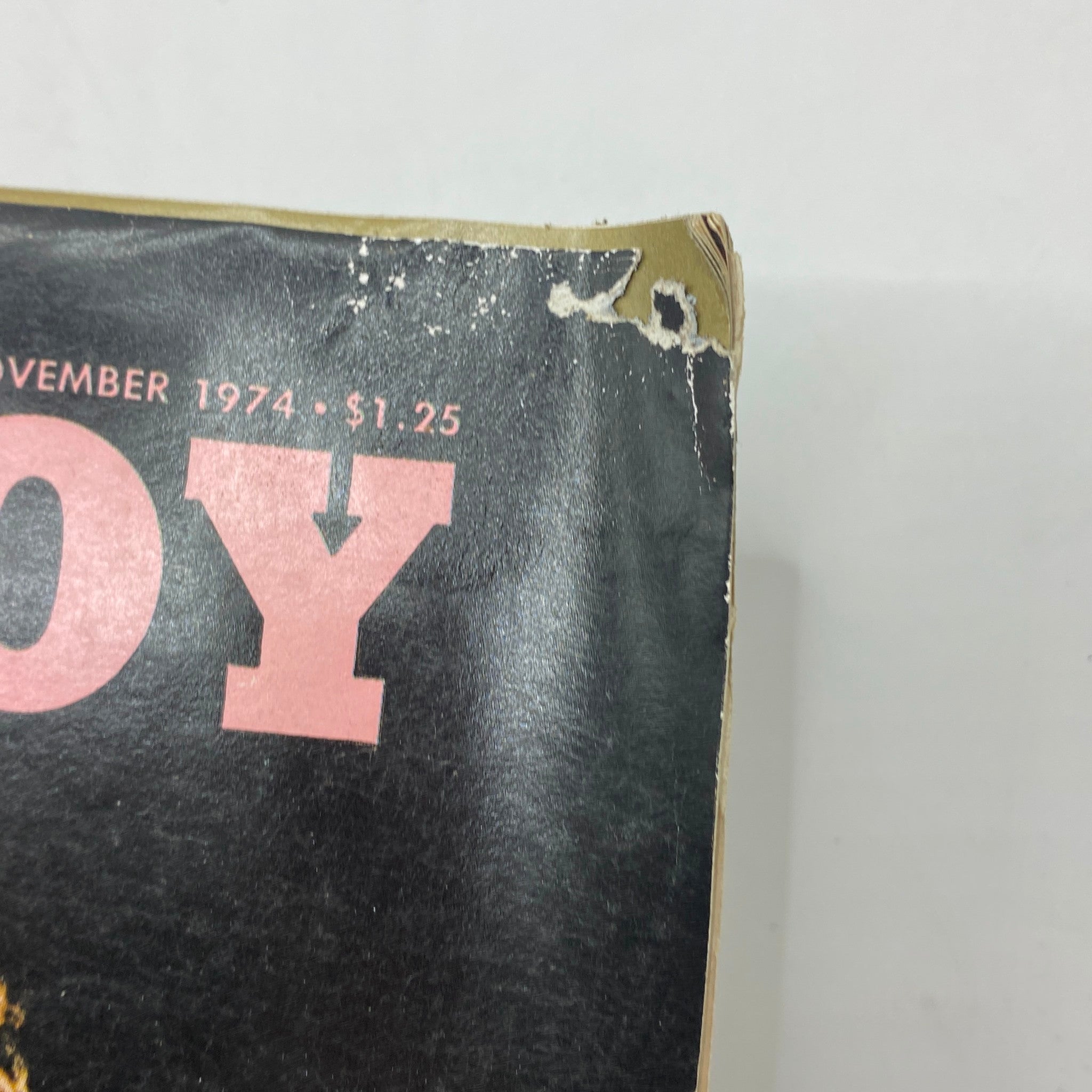 Close-up of the top corner of the Playboy Magazine November 1974, highlighting wear on the cover while retaining its vintage charm.