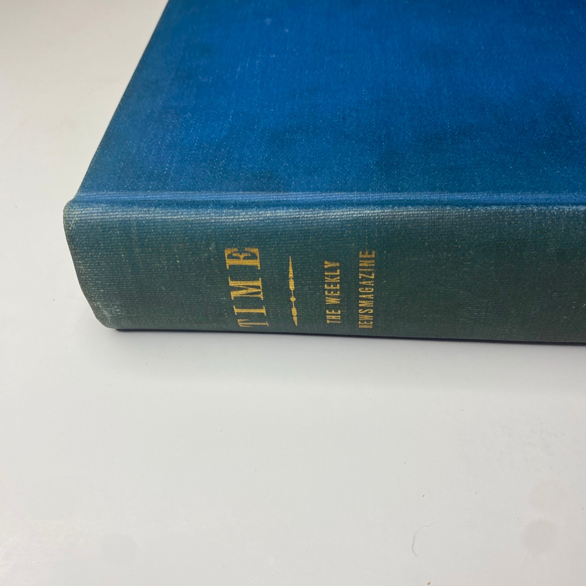 Close-up view of the spine of Time Magazine Library Bound July-September 1942 edition, titled 'The Weekly News Magazine'.