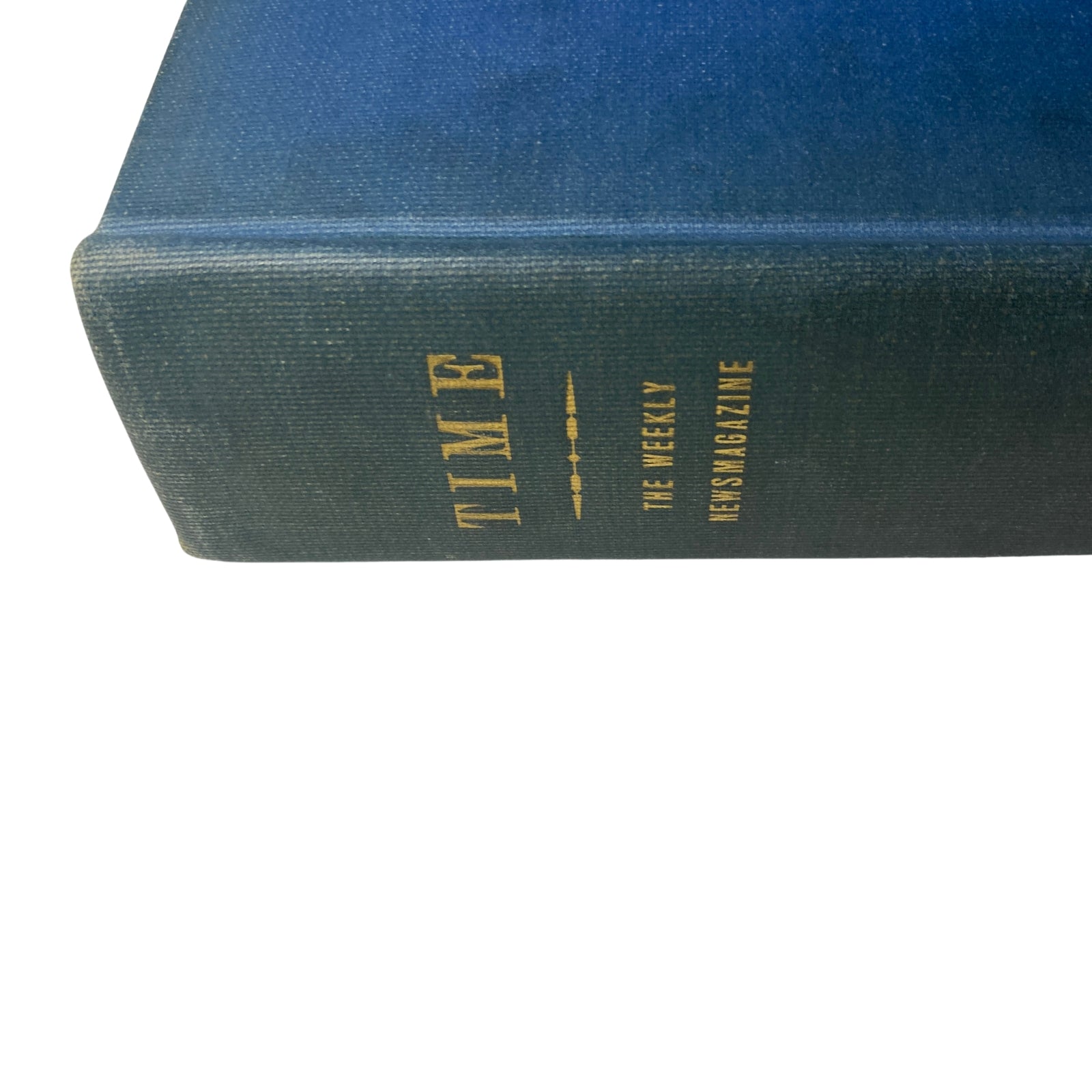 Close-up of the spine of the Time Magazine Library Bound Weekly, highlighting the publication year and volume number.