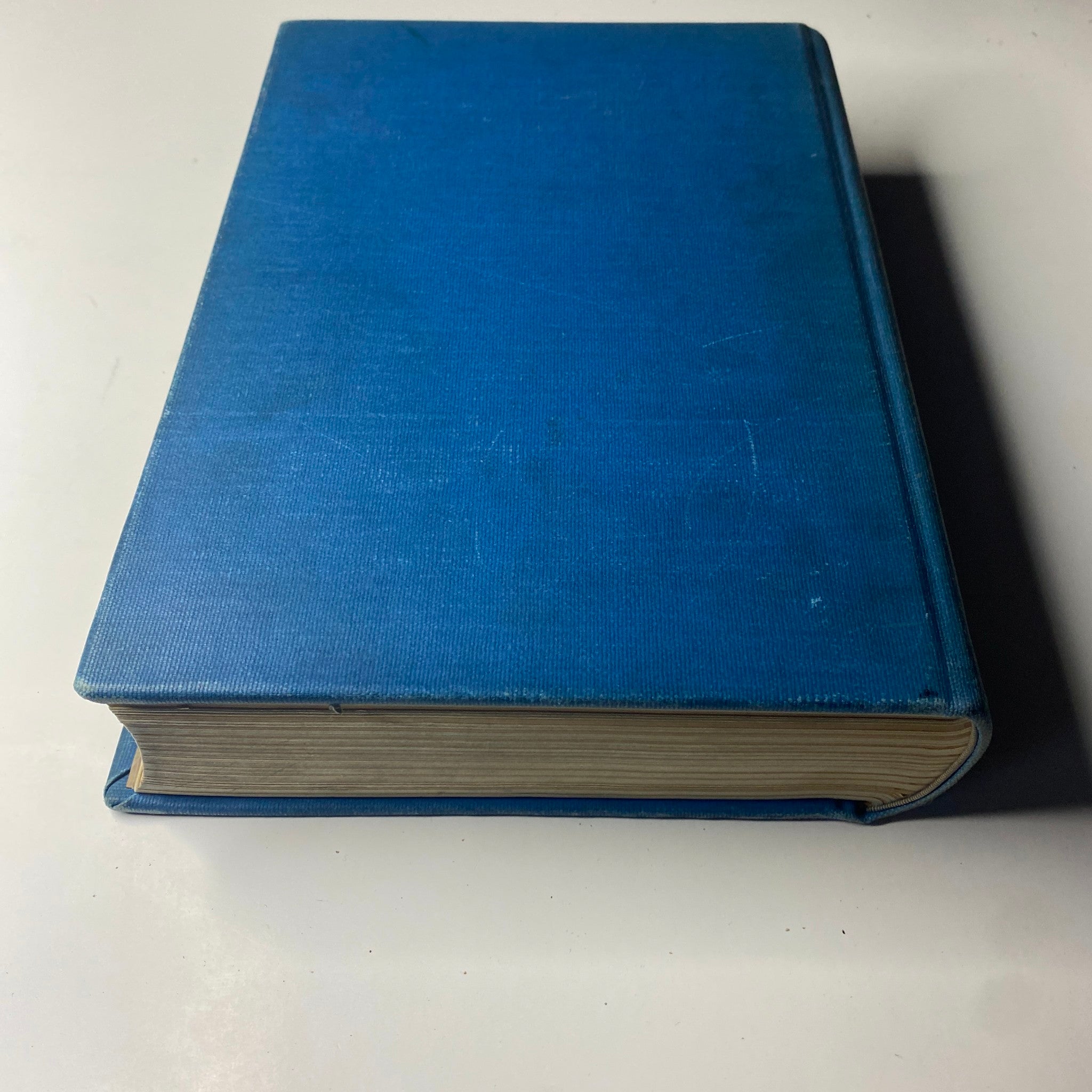 Side view of the Library Bound Weekly Edition of Time Magazine from October 5 to December 21, 1942. The book shows a blue cover and gold-edged pages.