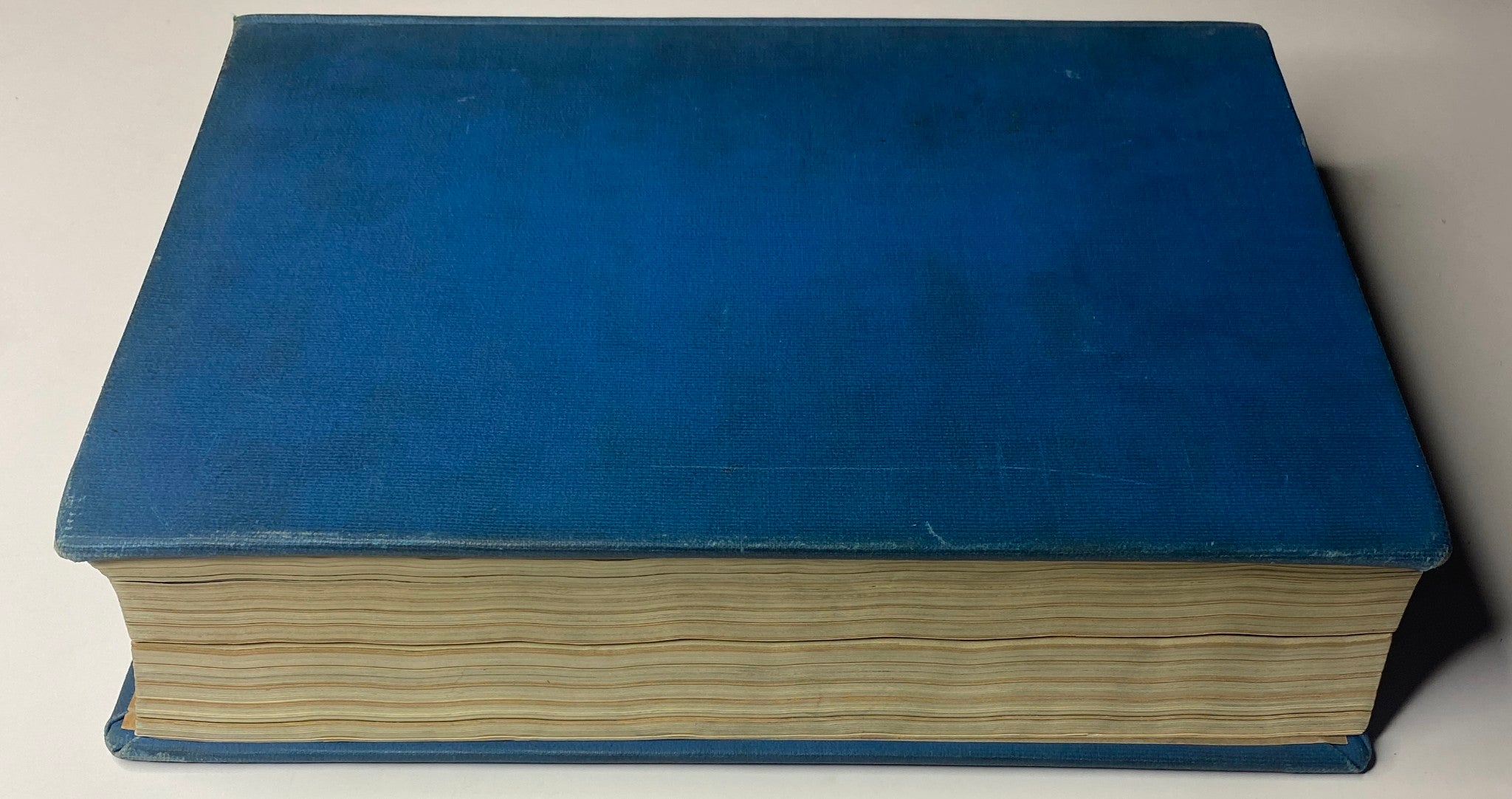 Top view of the 'Time Magazine Library Bound Weekly' volume, displaying the textured blue cover and open edges.